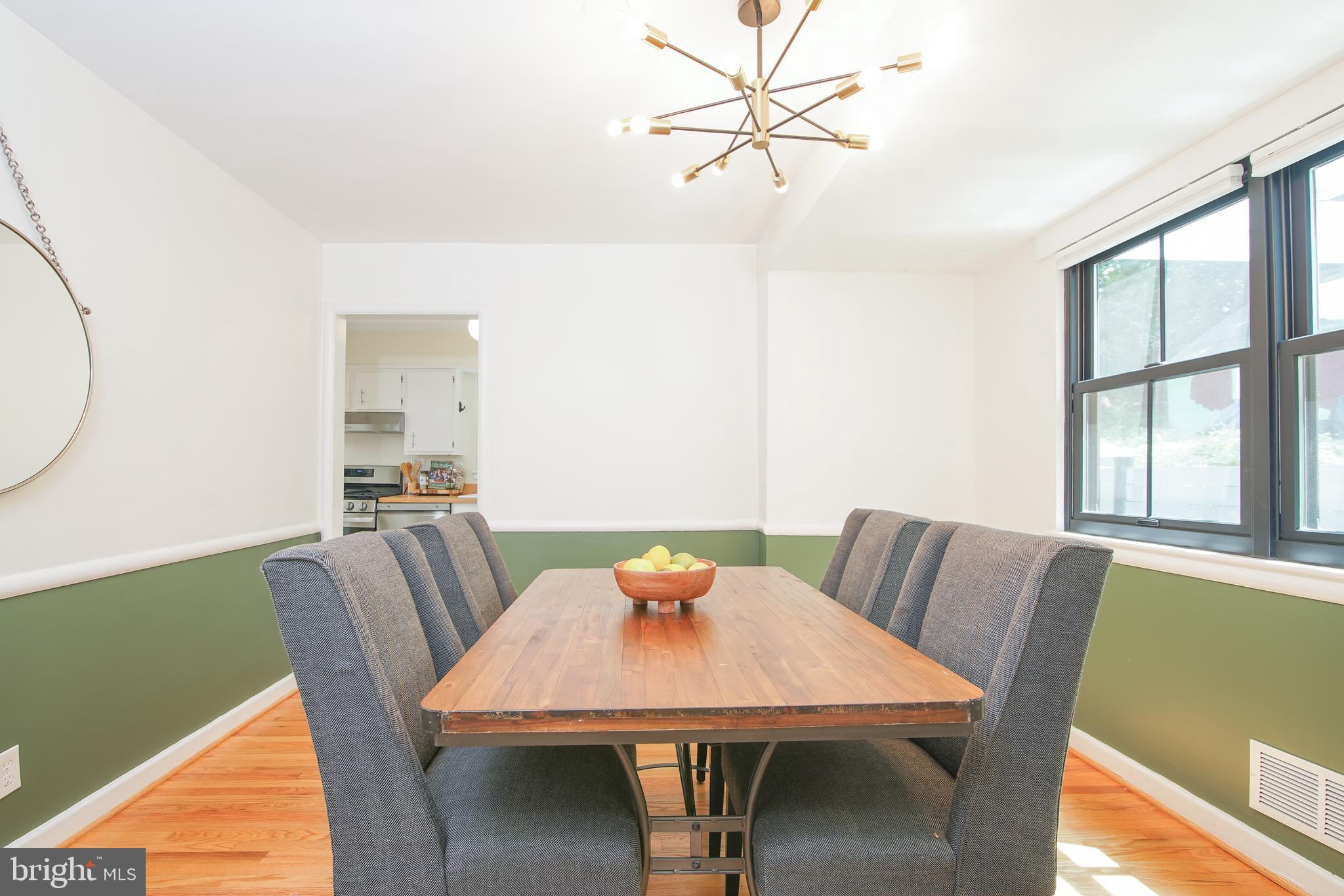 5602 Hawthorne Street Capitol Heights, MD 20743 - Photo 11 of 68 a view of a dining room with furniture window and wooden floor