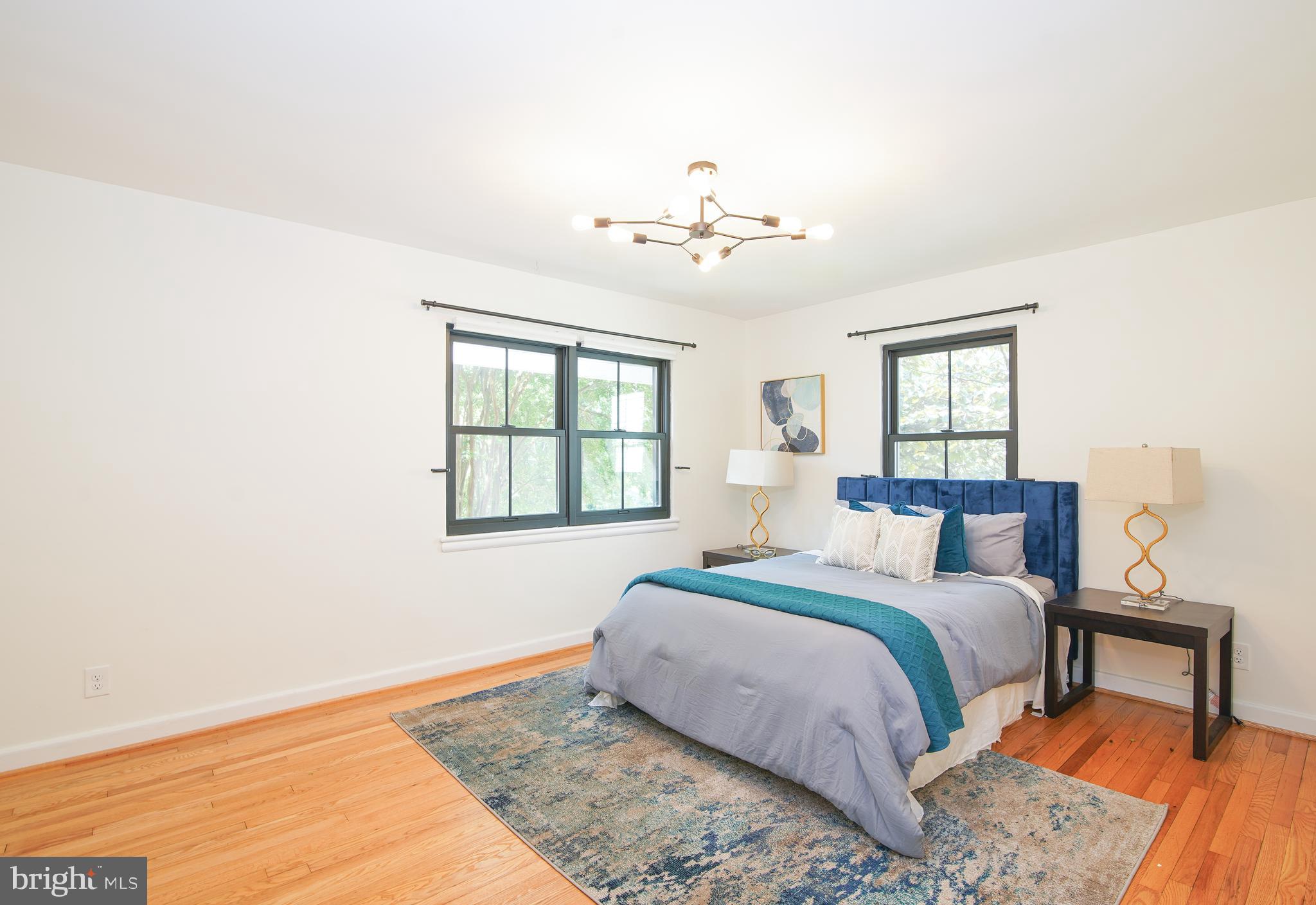 5602 Hawthorne Street Capitol Heights, MD 20743 - Photo 18 of 68 a bedroom with a large bed and a window
