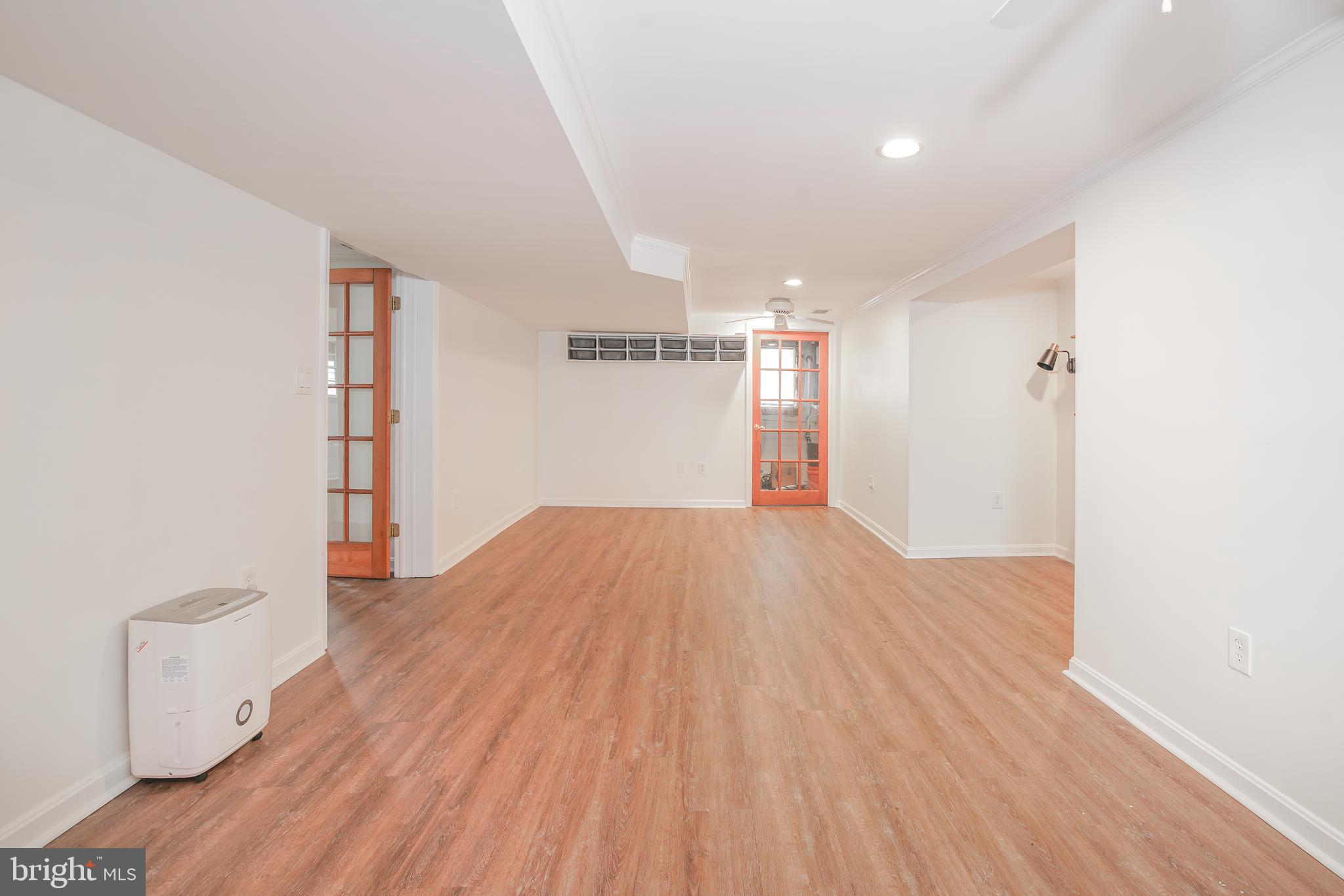 5602 Hawthorne Street Capitol Heights, MD 20743 - Photo 32 of 68 a view of empty room with wooden floor