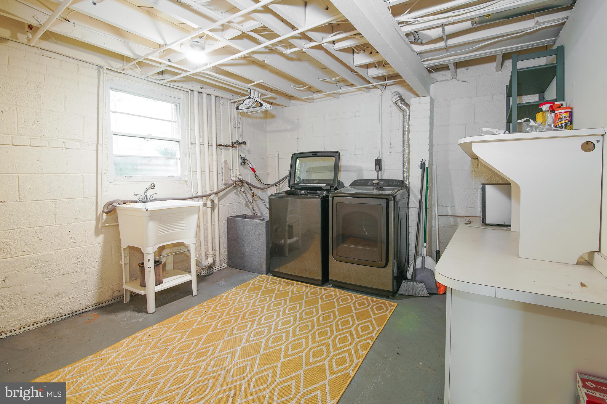 5602 Hawthorne Street Capitol Heights, MD 20743 - Photo 34 of 68 a storage room with washer and dryer