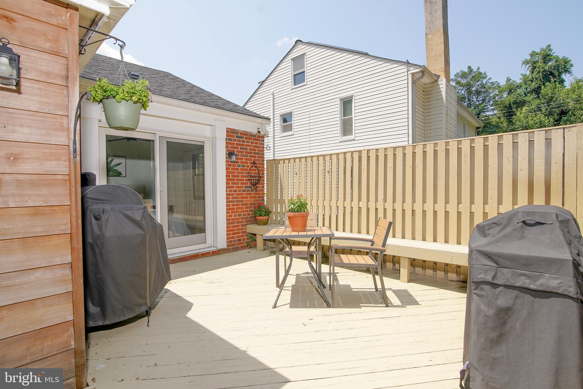 5602 Hawthorne Street Capitol Heights, MD 20743 - Photo 38 of 68 a view of a patio with table and chairs and potted plants