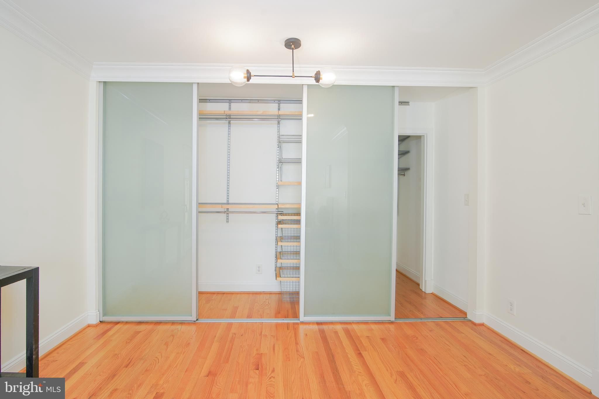 5602 Hawthorne Street Capitol Heights, MD 20743 - Photo 42 of 68 a view of a room with wooden floor and cabinet