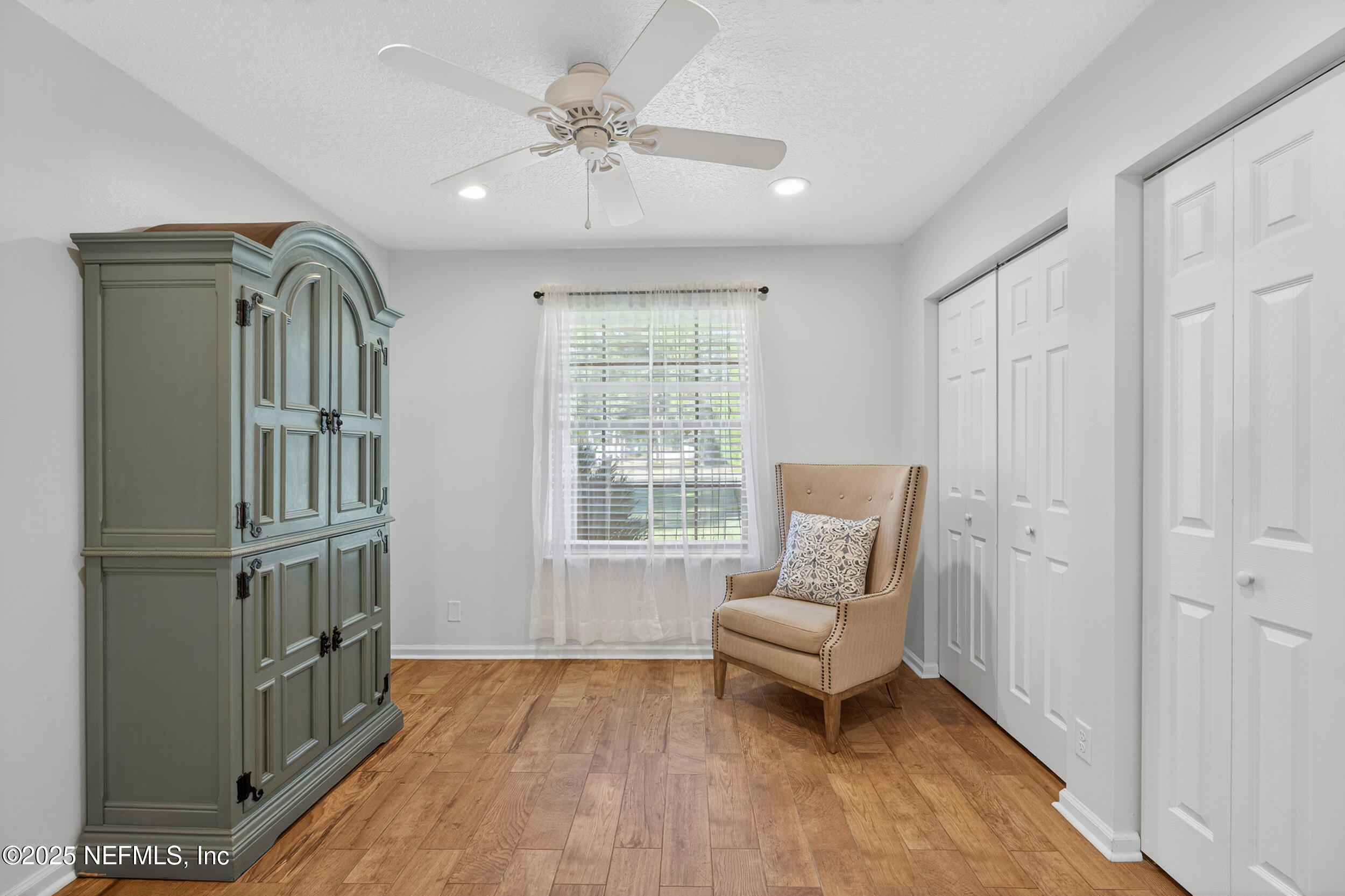 2836 Eagle Point Road Middleburg, FL 32068 - Photo 16 of 44 a living room with furniture and a window
