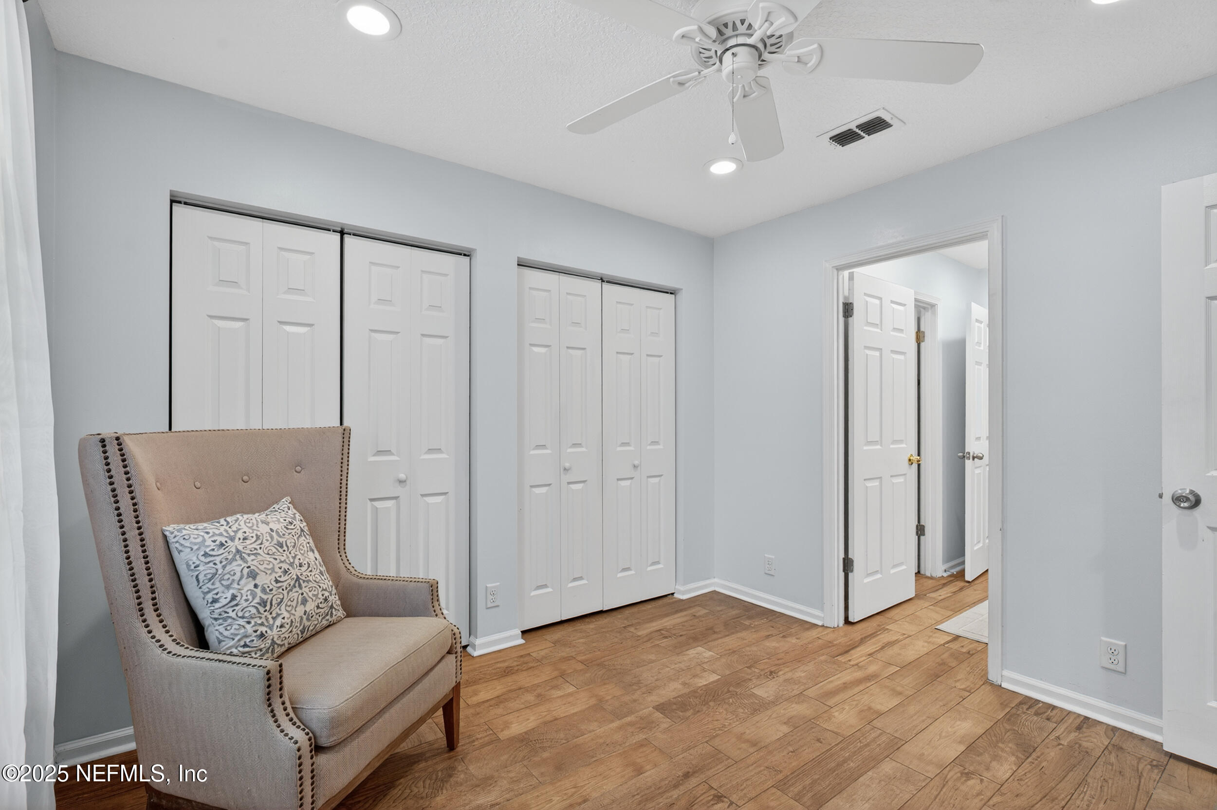 2836 Eagle Point Road Middleburg, FL 32068 - Photo 17 of 44 a living room with furniture and a chandelier