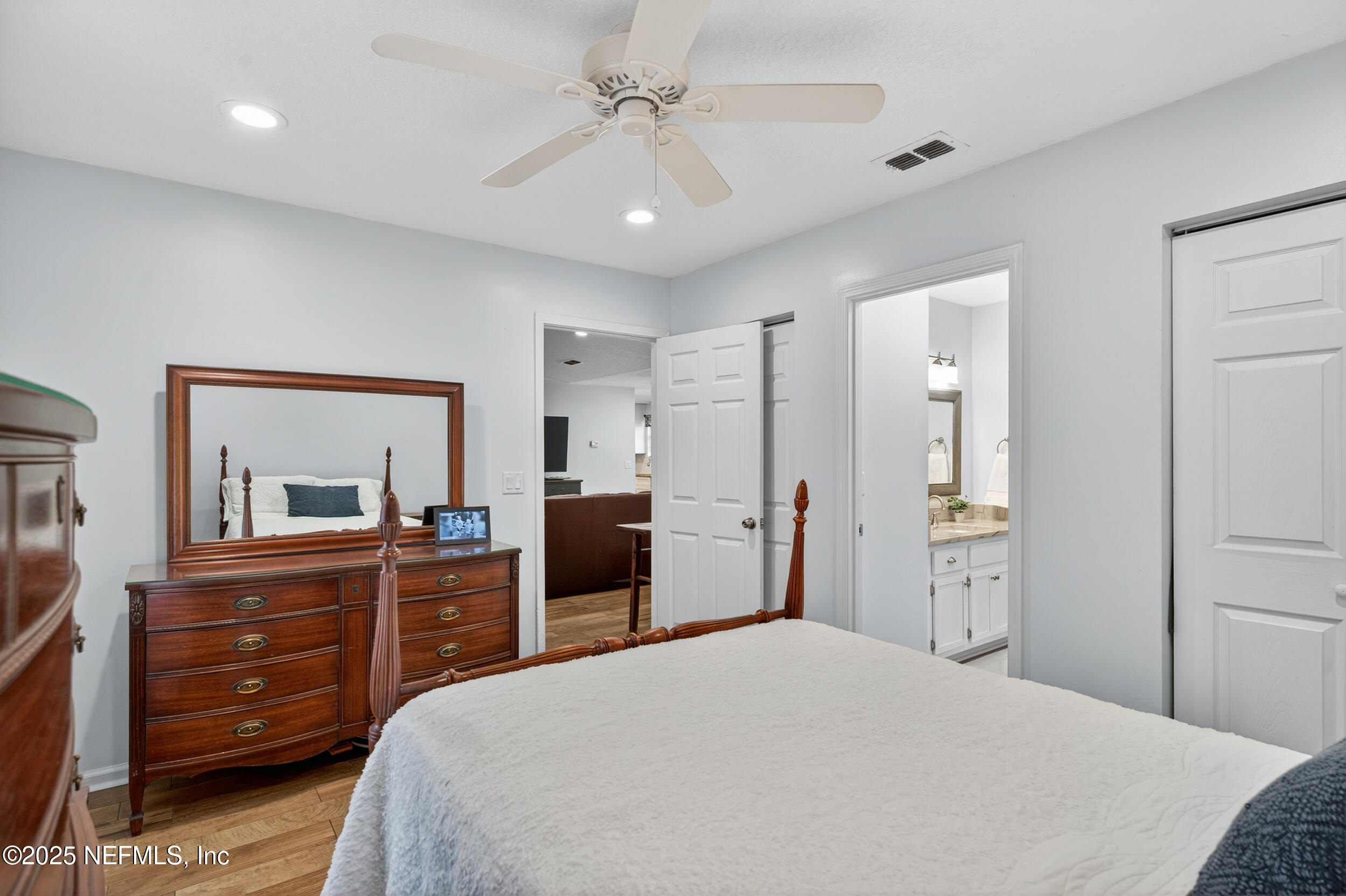 2836 Eagle Point Road Middleburg, FL 32068 - Photo 24 of 44 a bedroom with a bed and a dresser