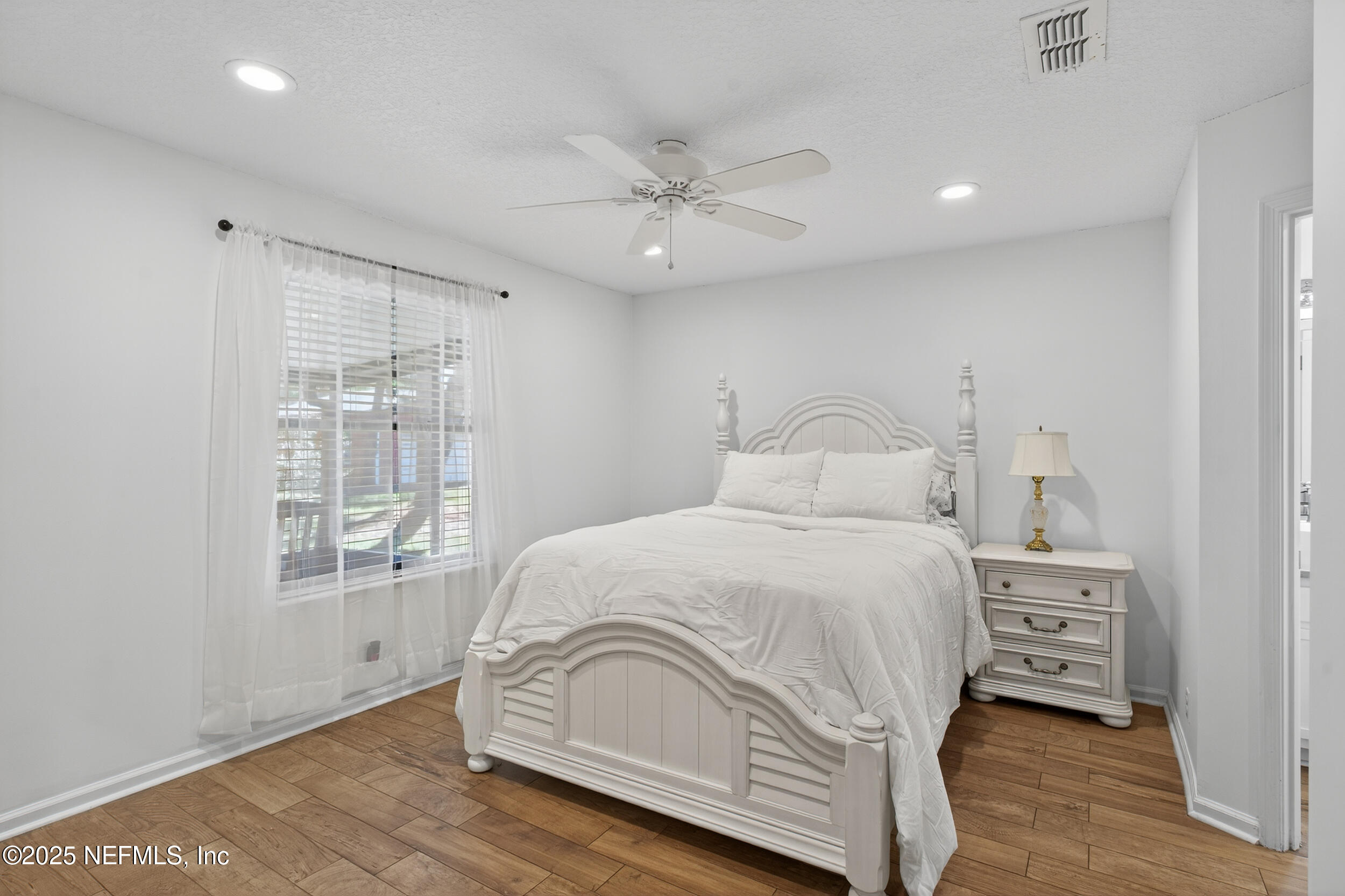 2836 Eagle Point Road Middleburg, FL 32068 - Photo 25 of 44 a bedroom with a bed and a window