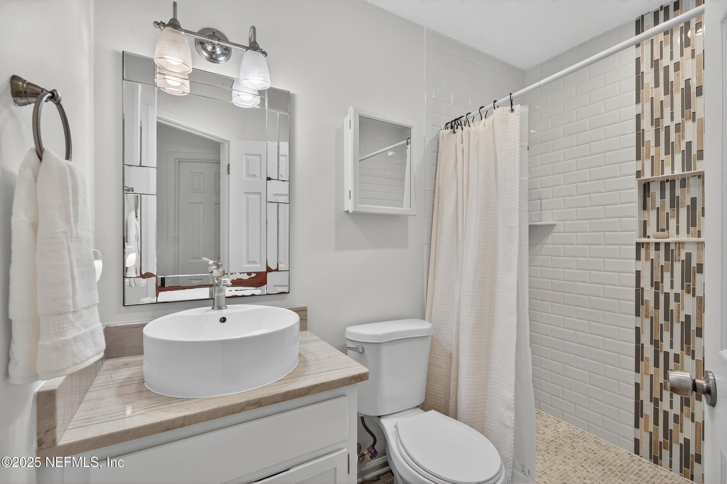 2836 Eagle Point Road Middleburg, FL 32068 - Photo 28 of 44 a bathroom with a sink toilet and shower