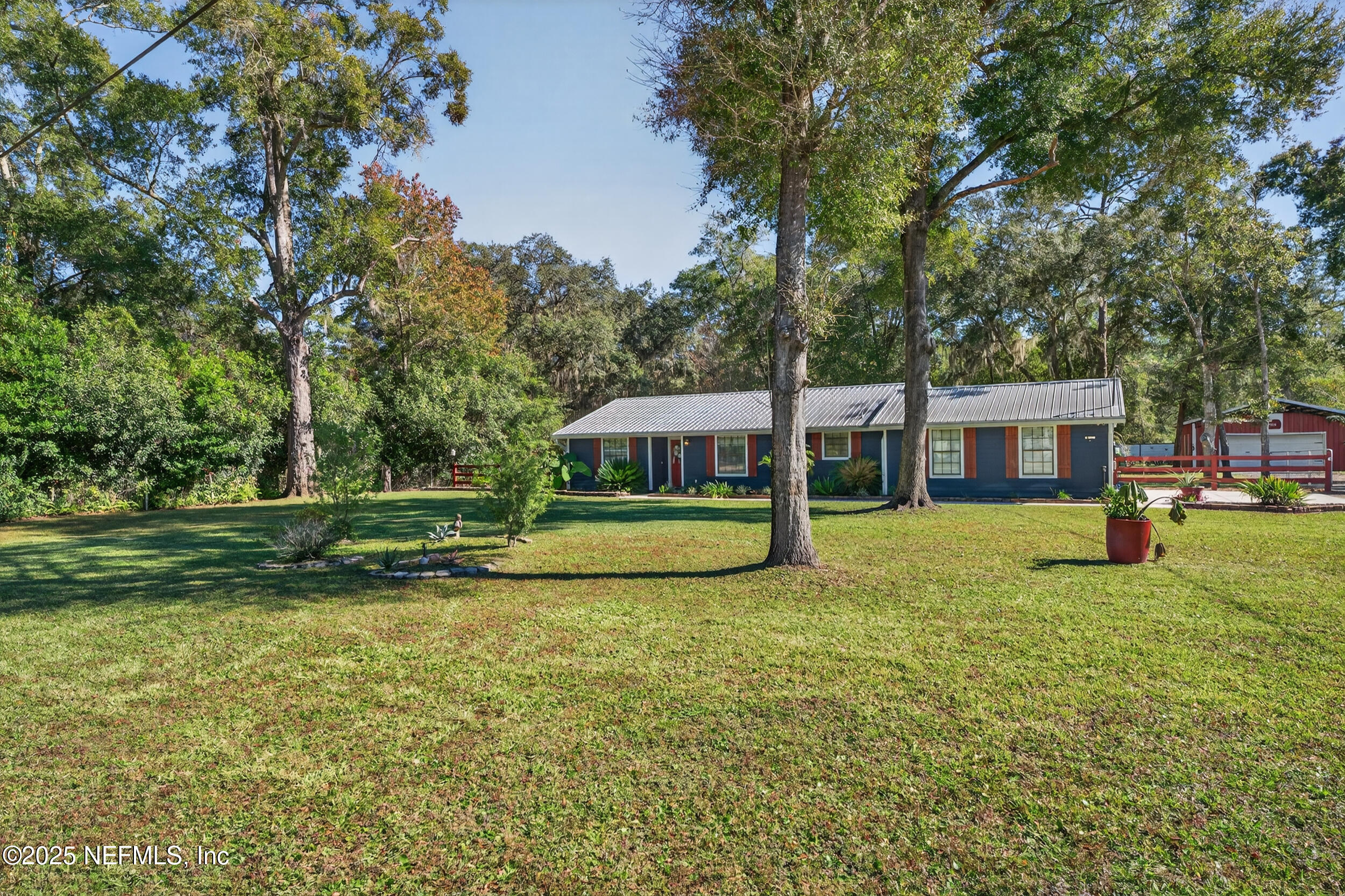 2836 Eagle Point Road Middleburg, FL 32068 - Photo 3 of 44 a view of a house with a yard and sitting area