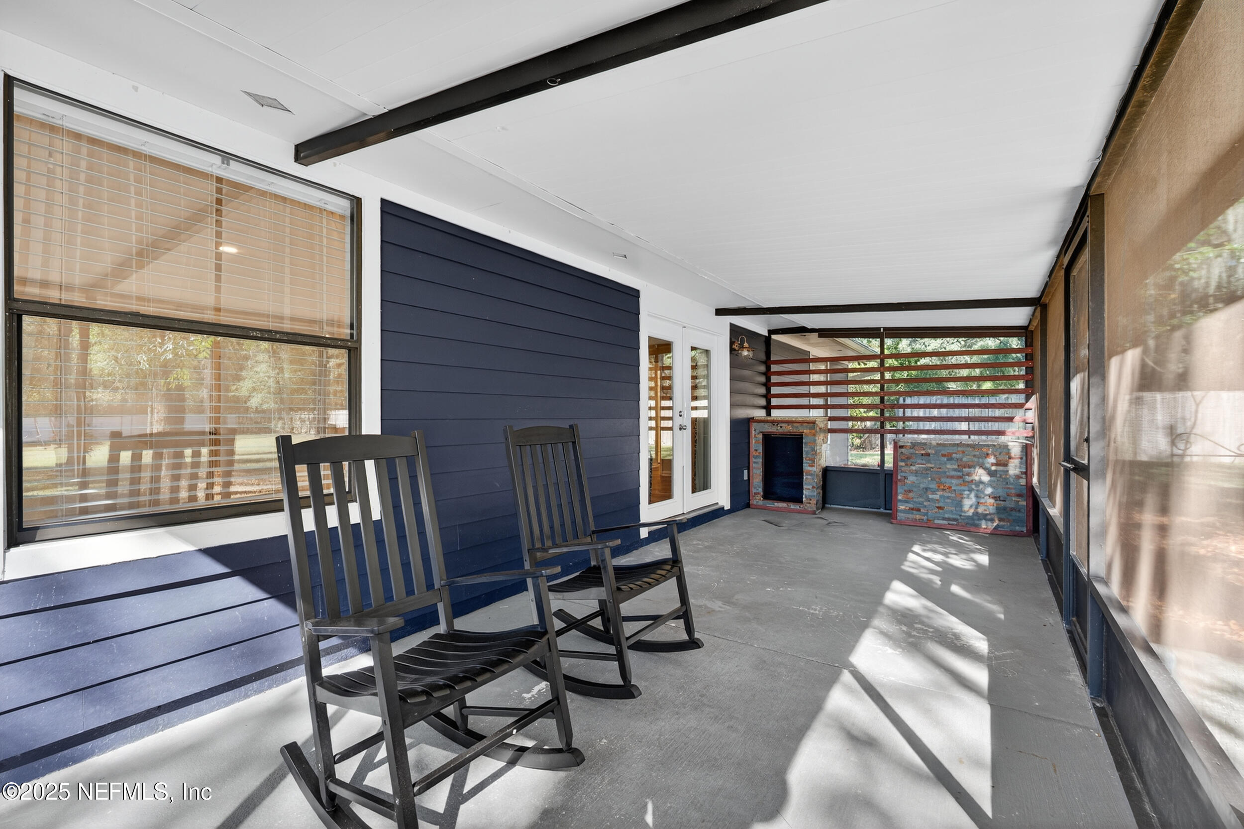 2836 Eagle Point Road Middleburg, FL 32068 - Photo 31 of 44 a view of a porch with furniture and floor to ceiling window