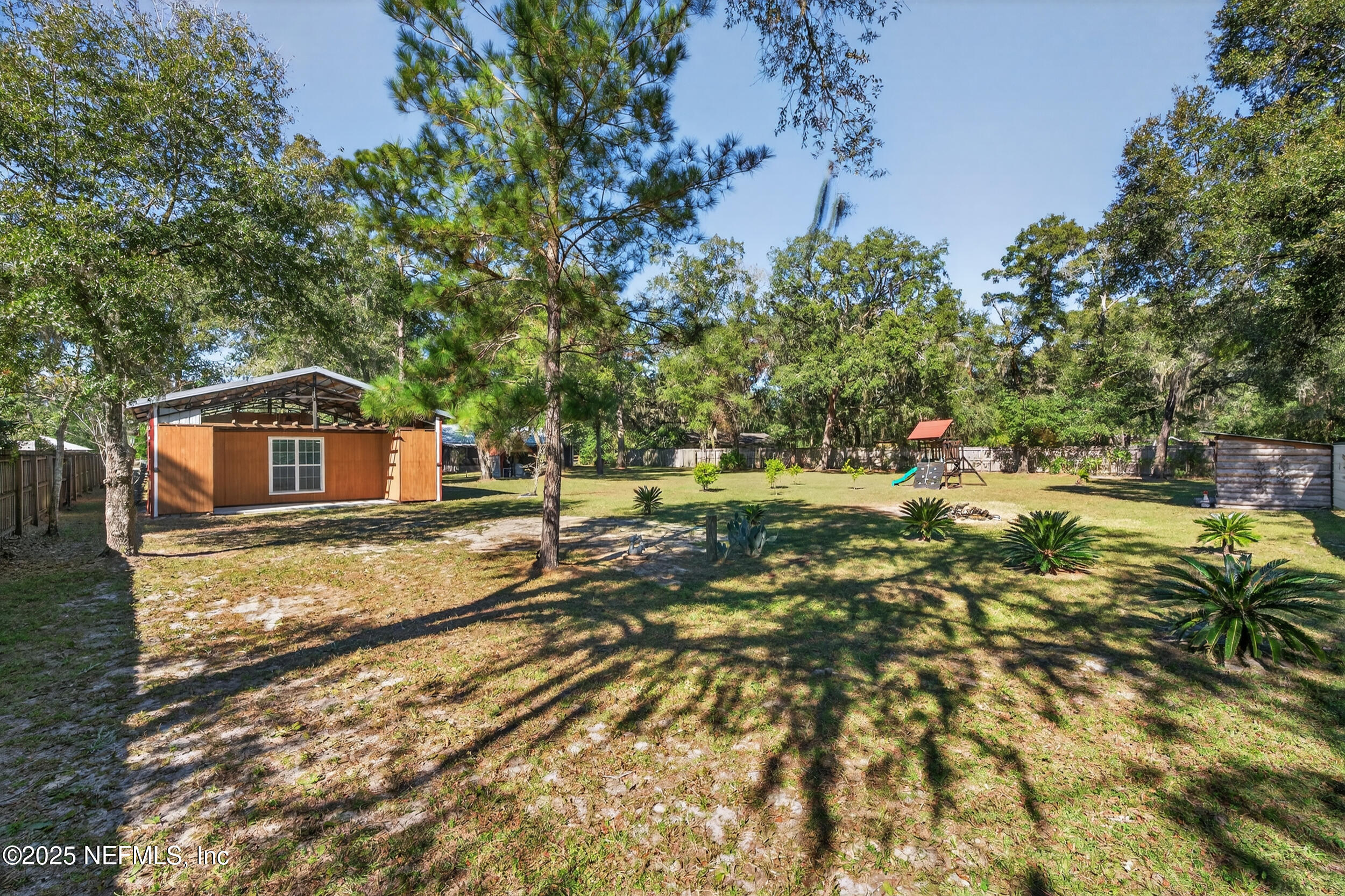 2836 Eagle Point Road Middleburg, FL 32068 - Photo 35 of 44 a view of a yard with swimming pool