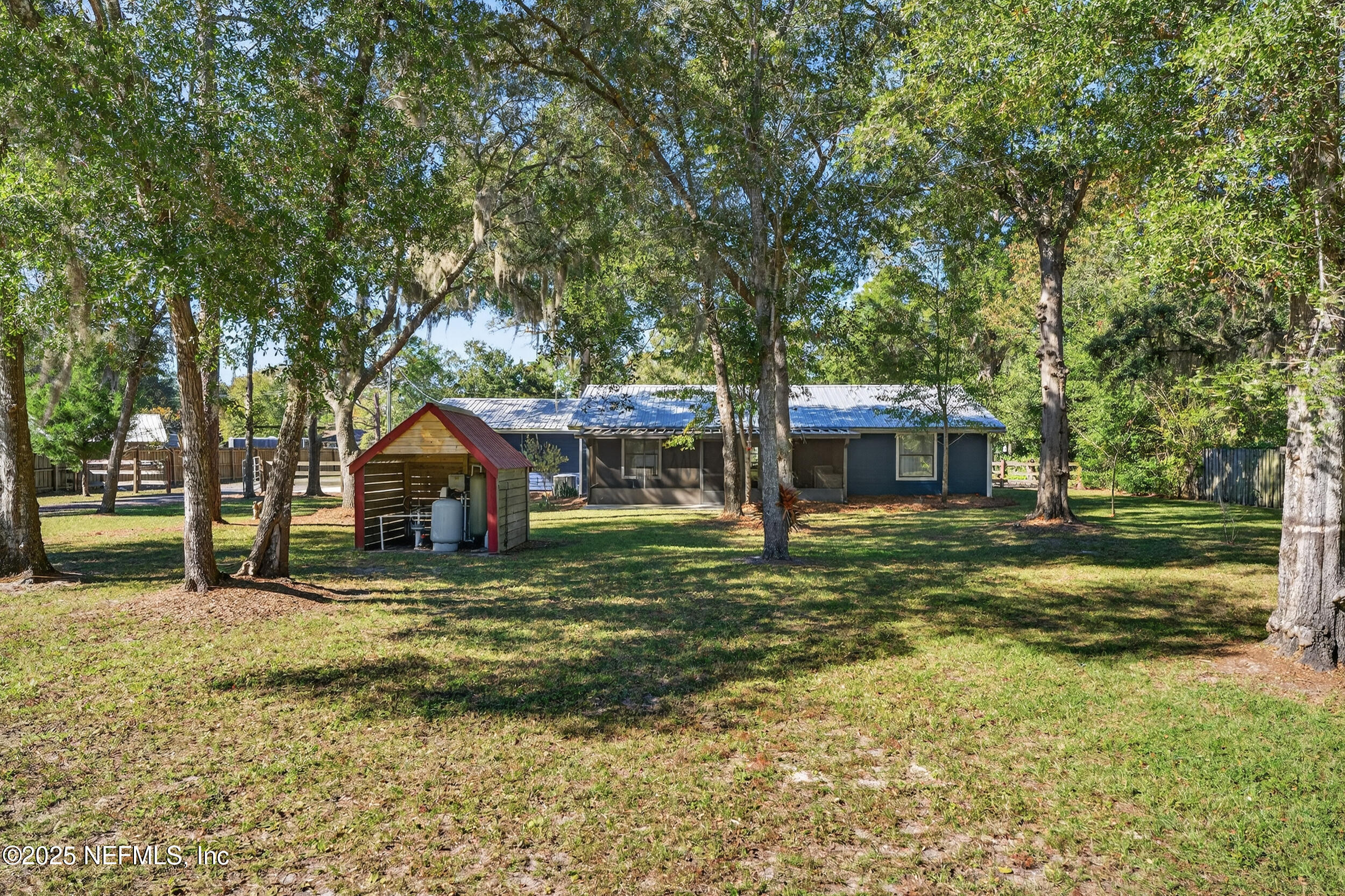 2836 Eagle Point Road Middleburg, FL 32068 - Photo 37 of 44 a house with trees in front of it