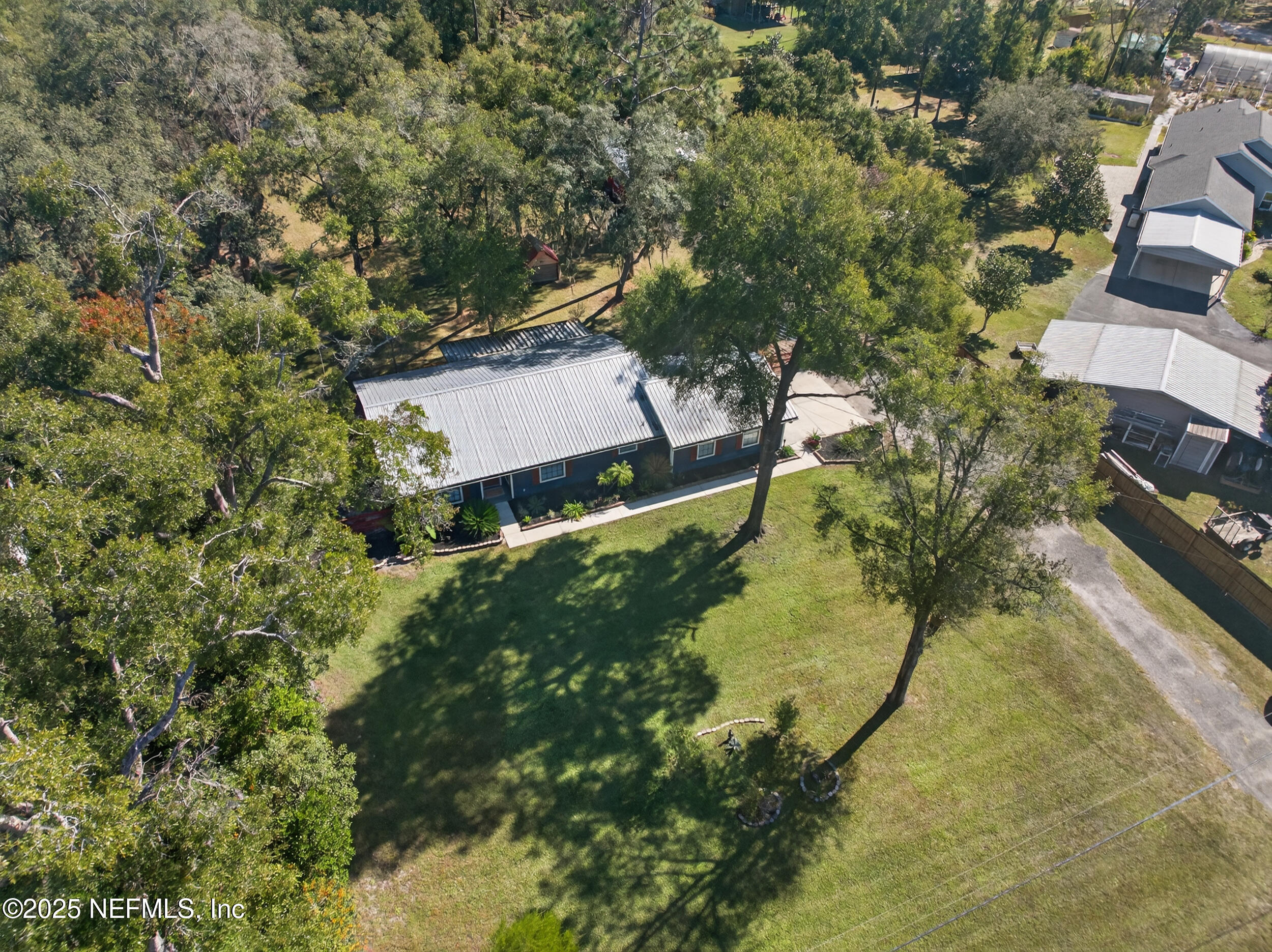 2836 Eagle Point Road Middleburg, FL 32068 - Photo 42 of 44 an aerial view of residential house with pool and trees