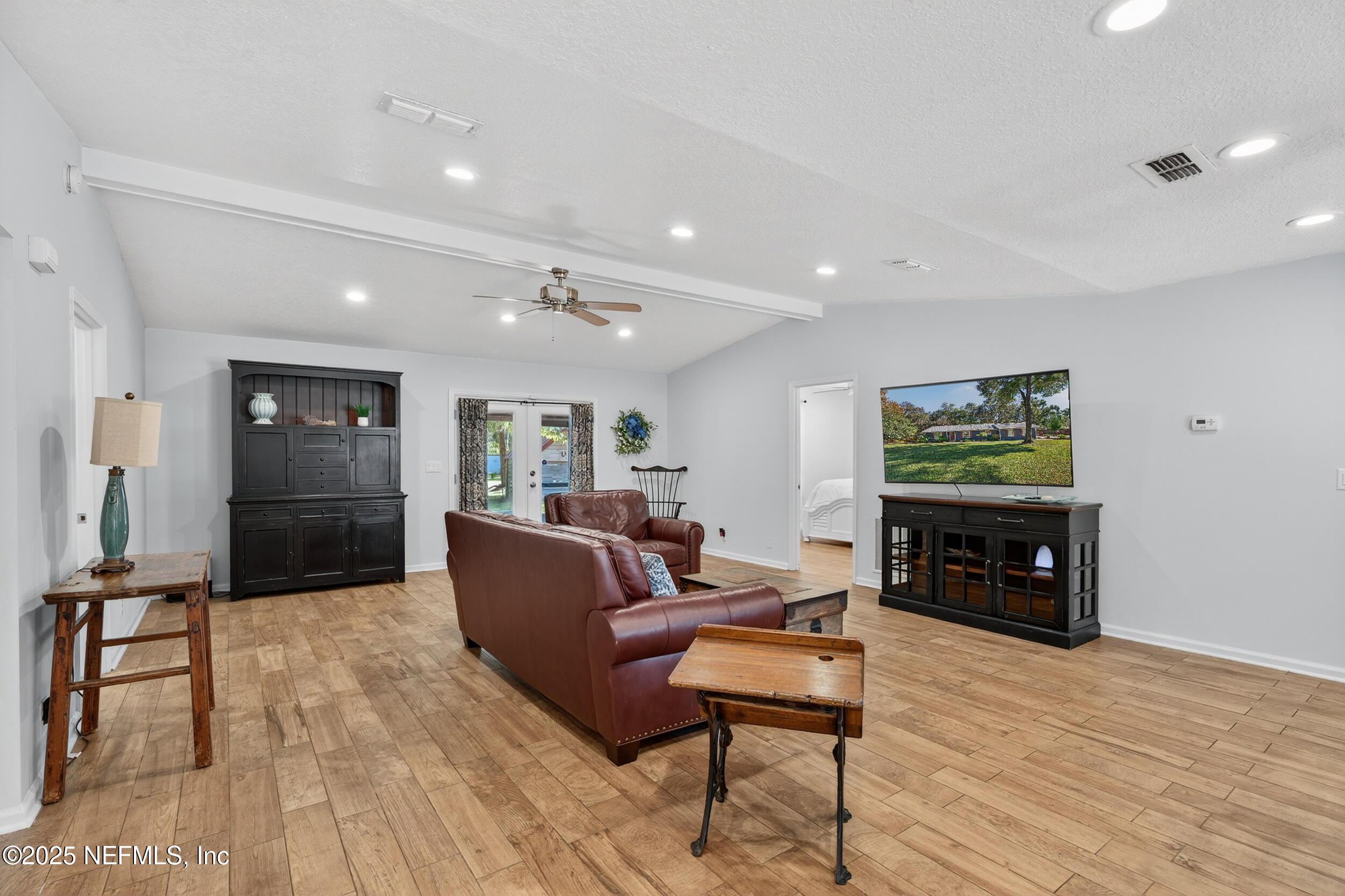 2836 Eagle Point Road Middleburg, FL 32068 - Photo 6 of 44 a living room with furniture and wooden floor