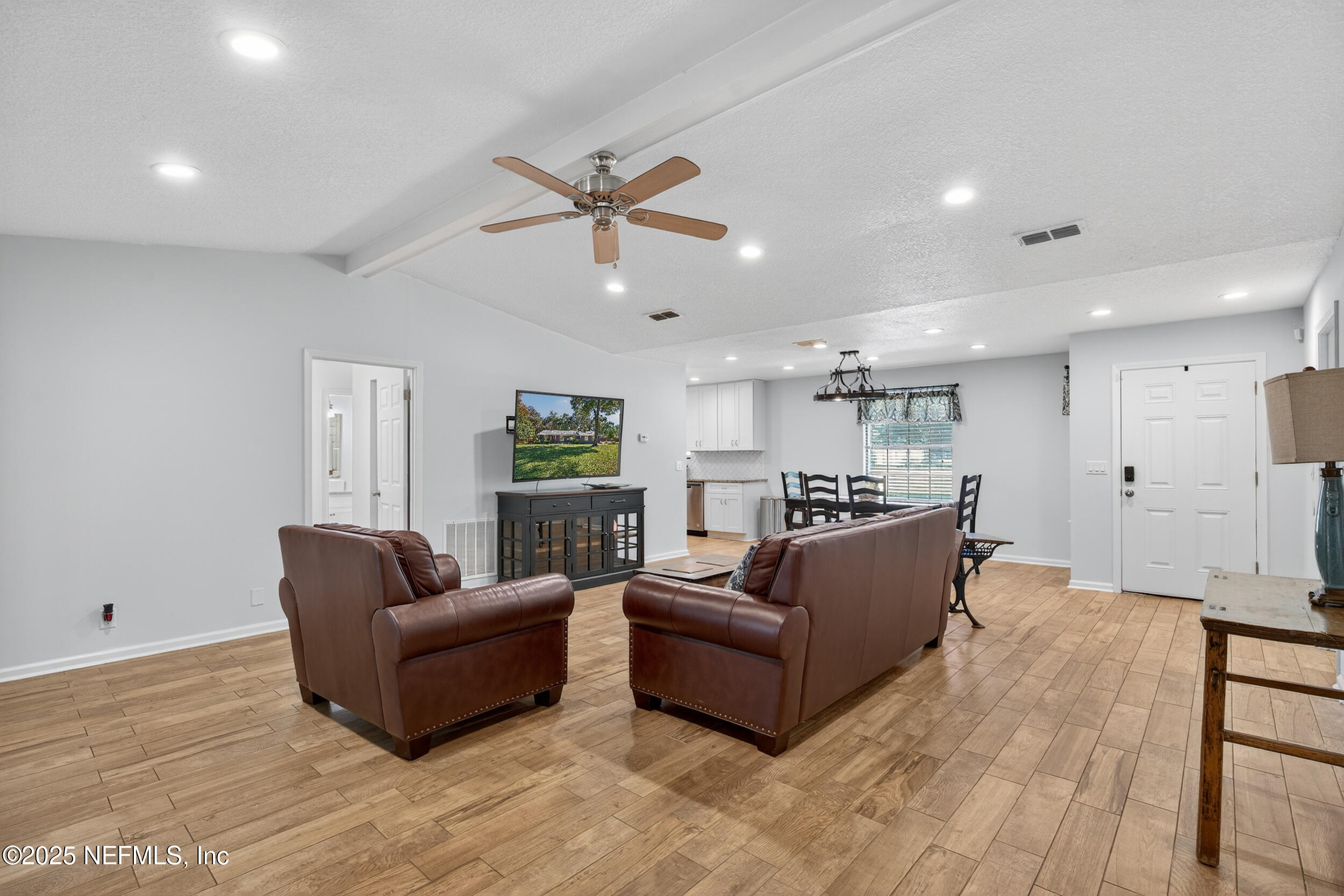 2836 Eagle Point Road Middleburg, FL 32068 - Photo 7 of 44 a living room with furniture and a ceiling fan