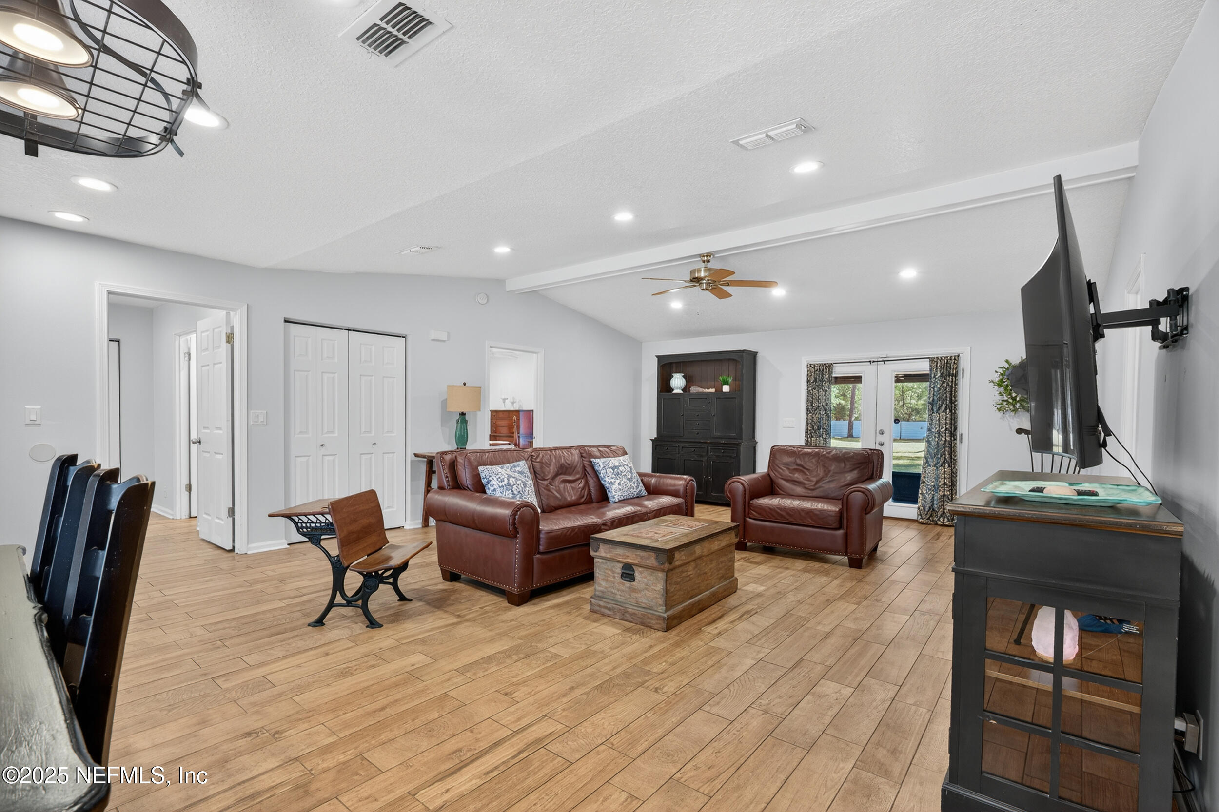 2836 Eagle Point Road Middleburg, FL 32068 - Photo 9 of 44 a living room with furniture and a wooden floor