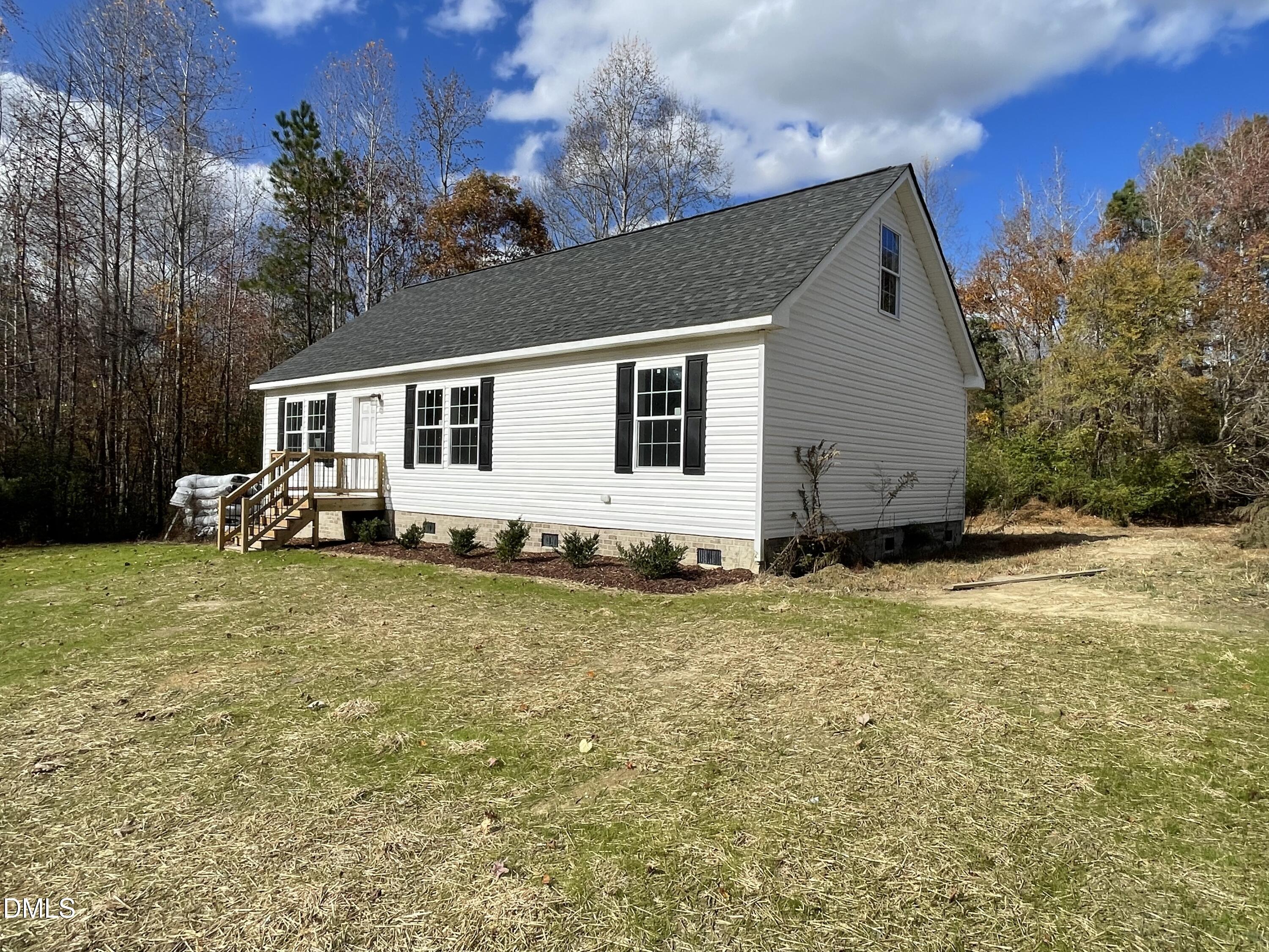 1398 Earpsboro Road Zebulon, NC 27597 - Photo 2 of 14 a backyard of a house with seating space