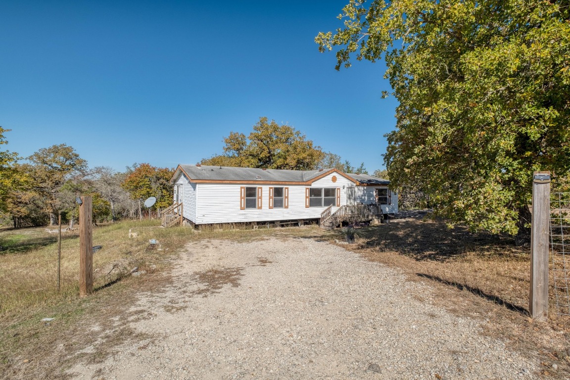 21400 Webberwood Ridge Drive Elgin, TX 78621 - Photo 3 of 22 a view of a house with a yard