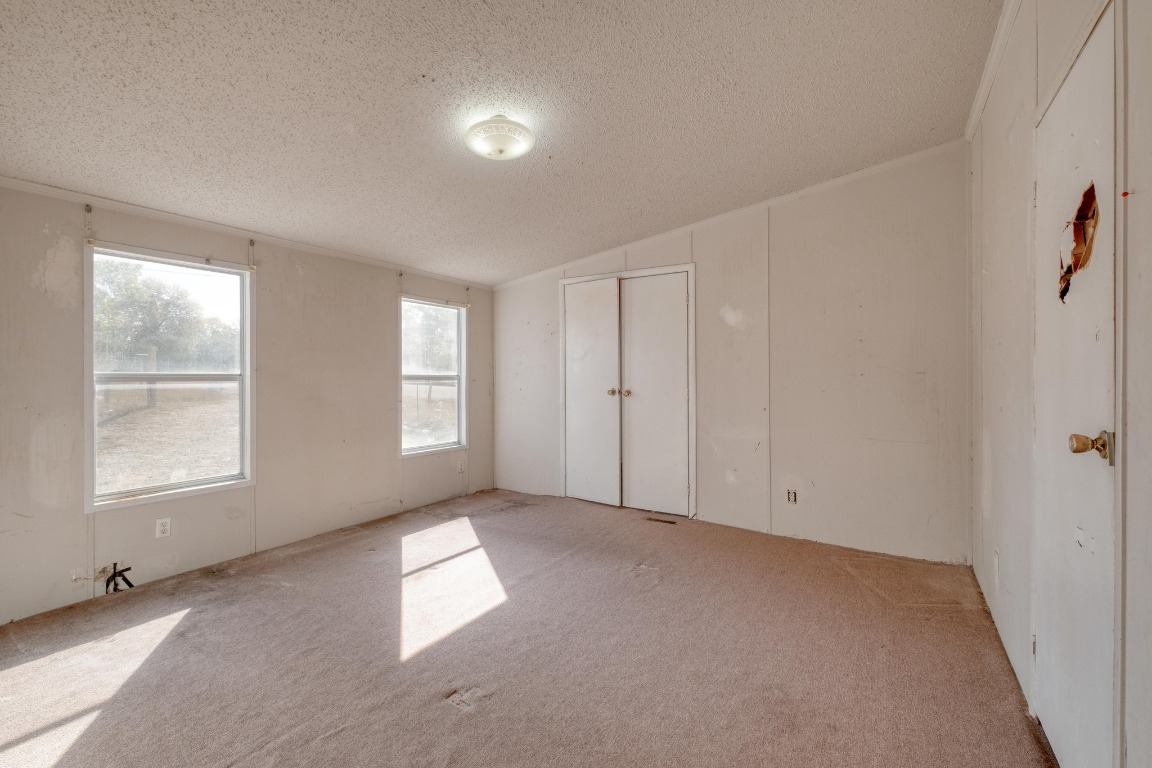 21400 Webberwood Ridge Drive Elgin, TX 78621 - Photo 9 of 22 an empty room with windows