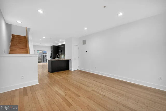 a view of a kitchen with a sink and a microwave
