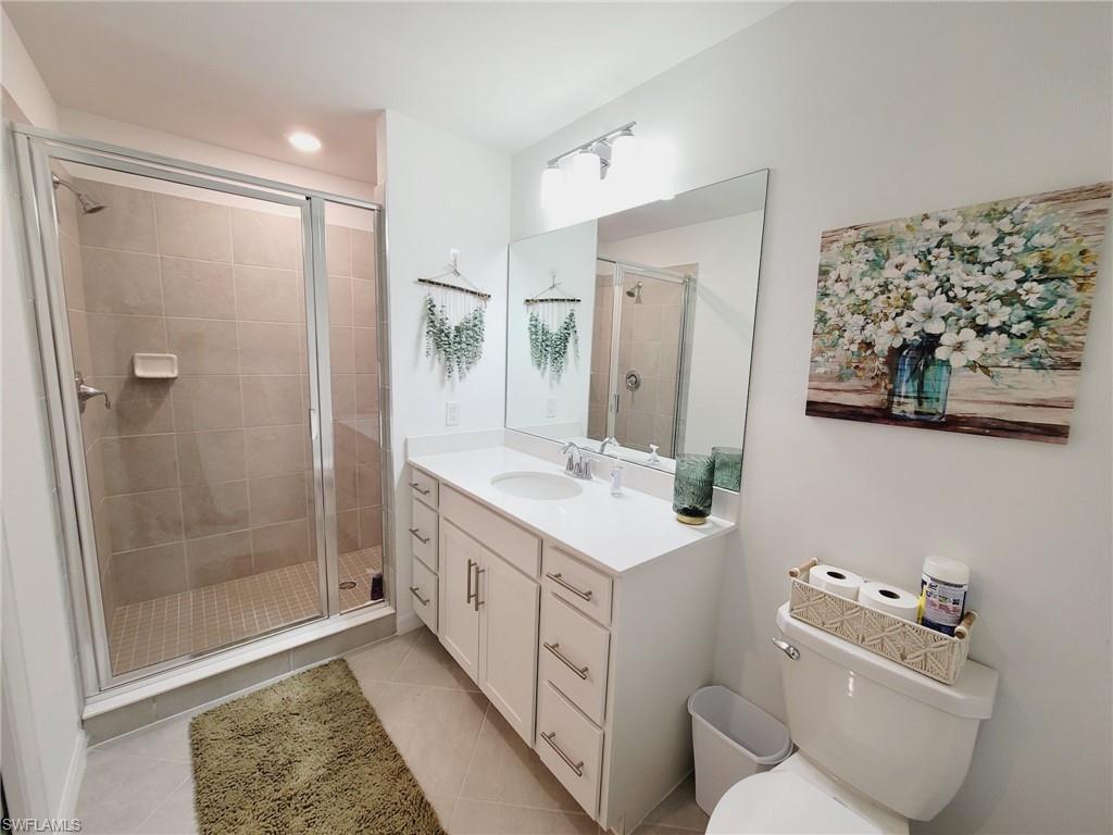 43997 Boardwalk Loop, Unit 1832 Babcock Ranch, FL 33982 - Photo 13 of 22 a bathroom with a double vanity sink mirror and shower