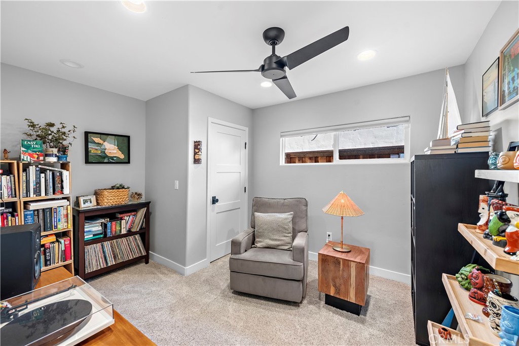 130 West Mariposa San Clemente, CA 92672 - Photo 14 of 43 a living room with furniture and a book shelf