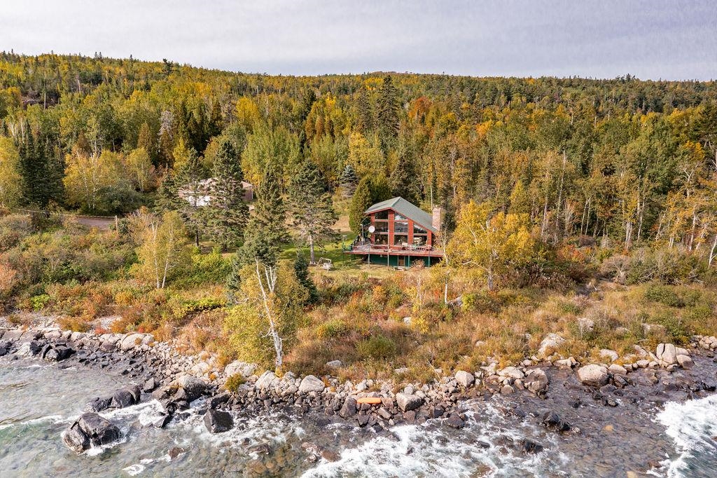 4346 Highway 61 Two Harbors, MN 55616 - Photo 27 of 65 Aerial view of property's location featuring a heavily wooded area and a nearby body of water
