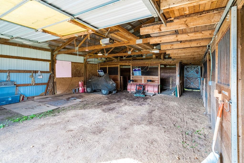 4346 Highway 61 Two Harbors, MN 55616 - Photo 55 of 65 Garage featuring a garage door opener and metal wall