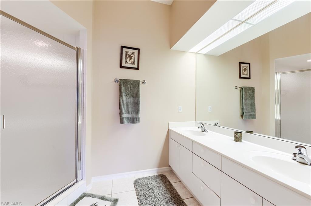 23810 Marbella Bay Road, Unit 202 Estero, FL 34135 - Photo 18 of 33 Master BathroomDouble sinks with generous counterspace and storage cabinetry