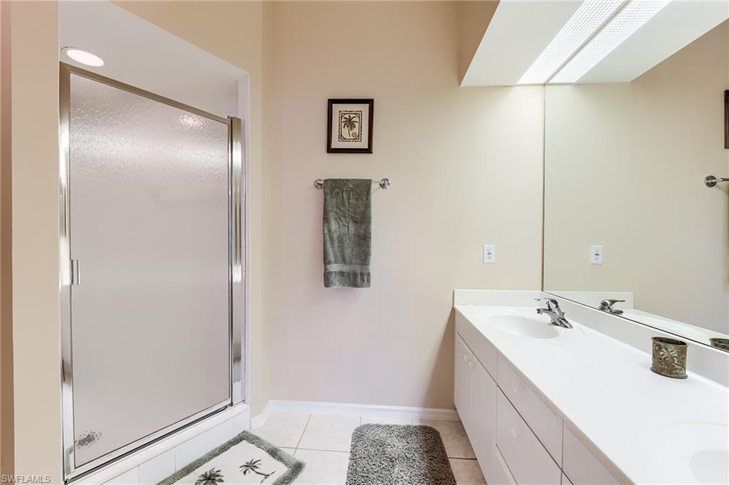 23810 Marbella Bay Road, Unit 202 Estero, FL 34135 - Photo 19 of 33 Master BathroomWith walk-in Shower