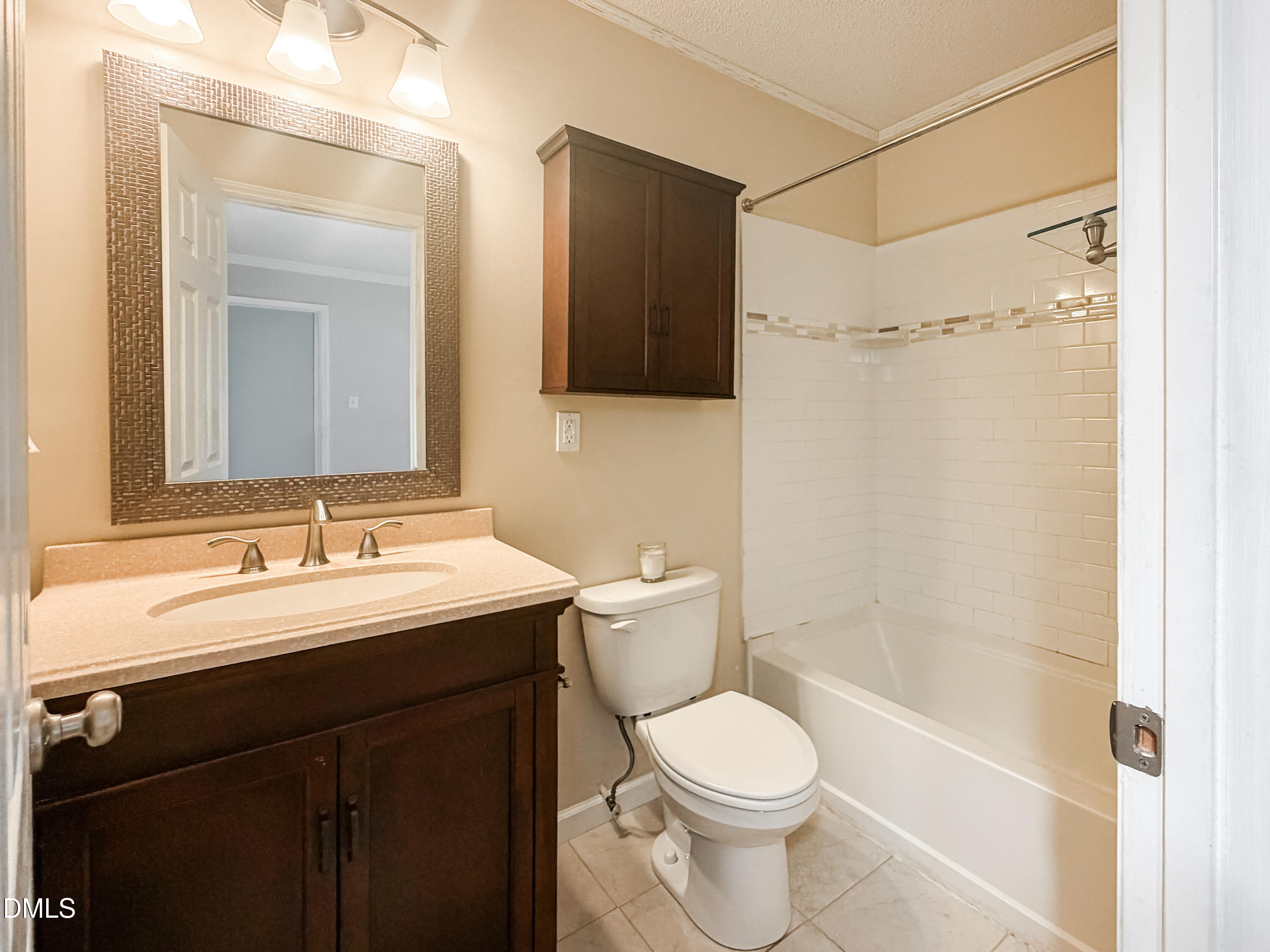 6304 Forest Ridge Drive Durham, NC 27713 - Photo 21 of 29 a bathroom with a sink a toilet and shower