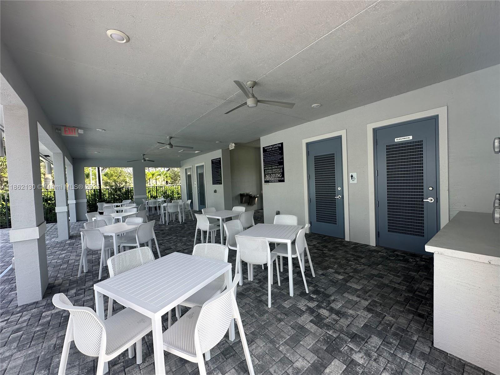 402 Southeast Crossoak Lane, Unit 402 Port St. Lucie, FL 34984 - Photo 12 of 87 a view of a dining room with furniture window and outside view