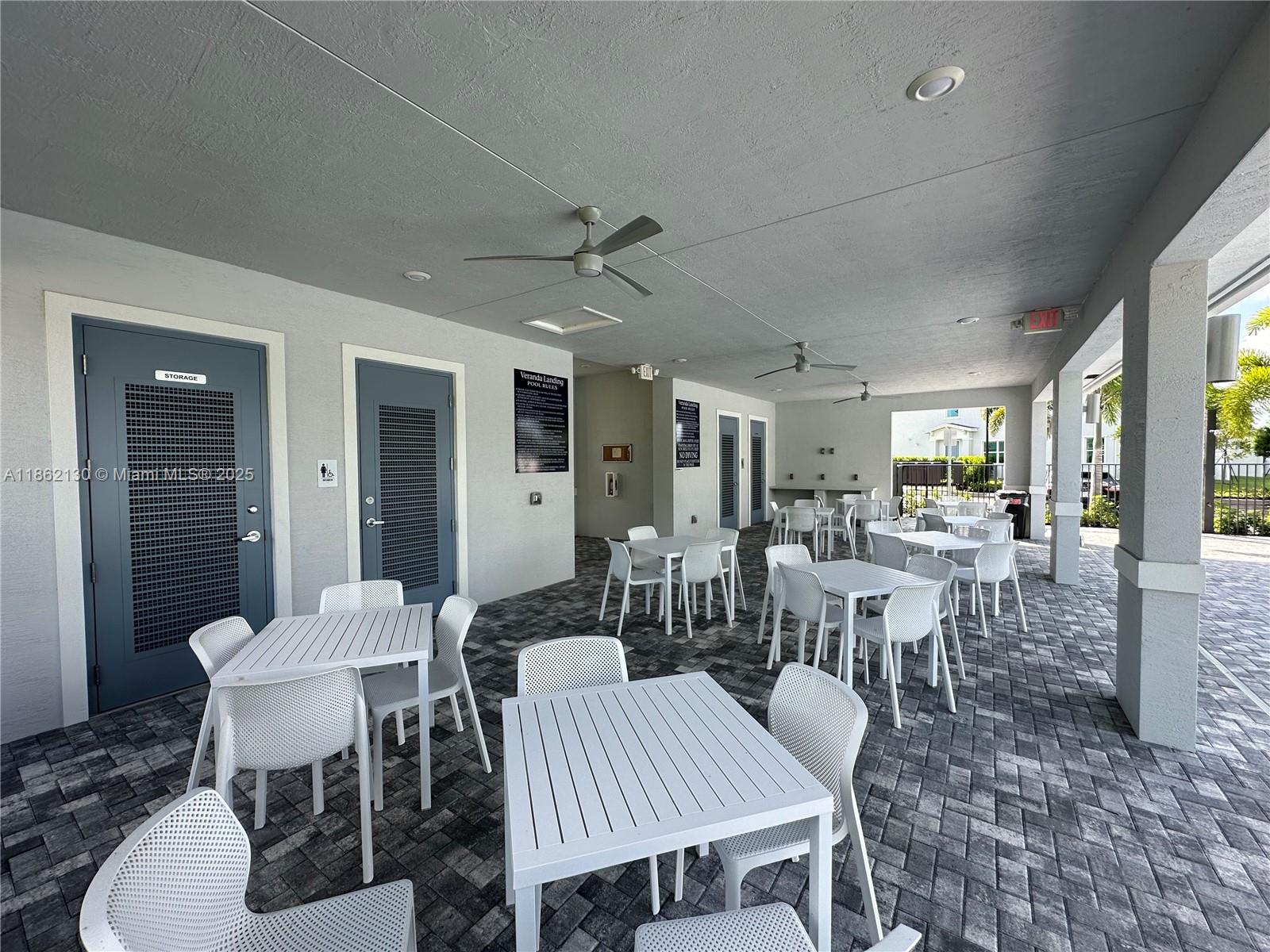 402 Southeast Crossoak Lane, Unit 402 Port St. Lucie, FL 34984 - Photo 15 of 87 a view of a dining room with furniture