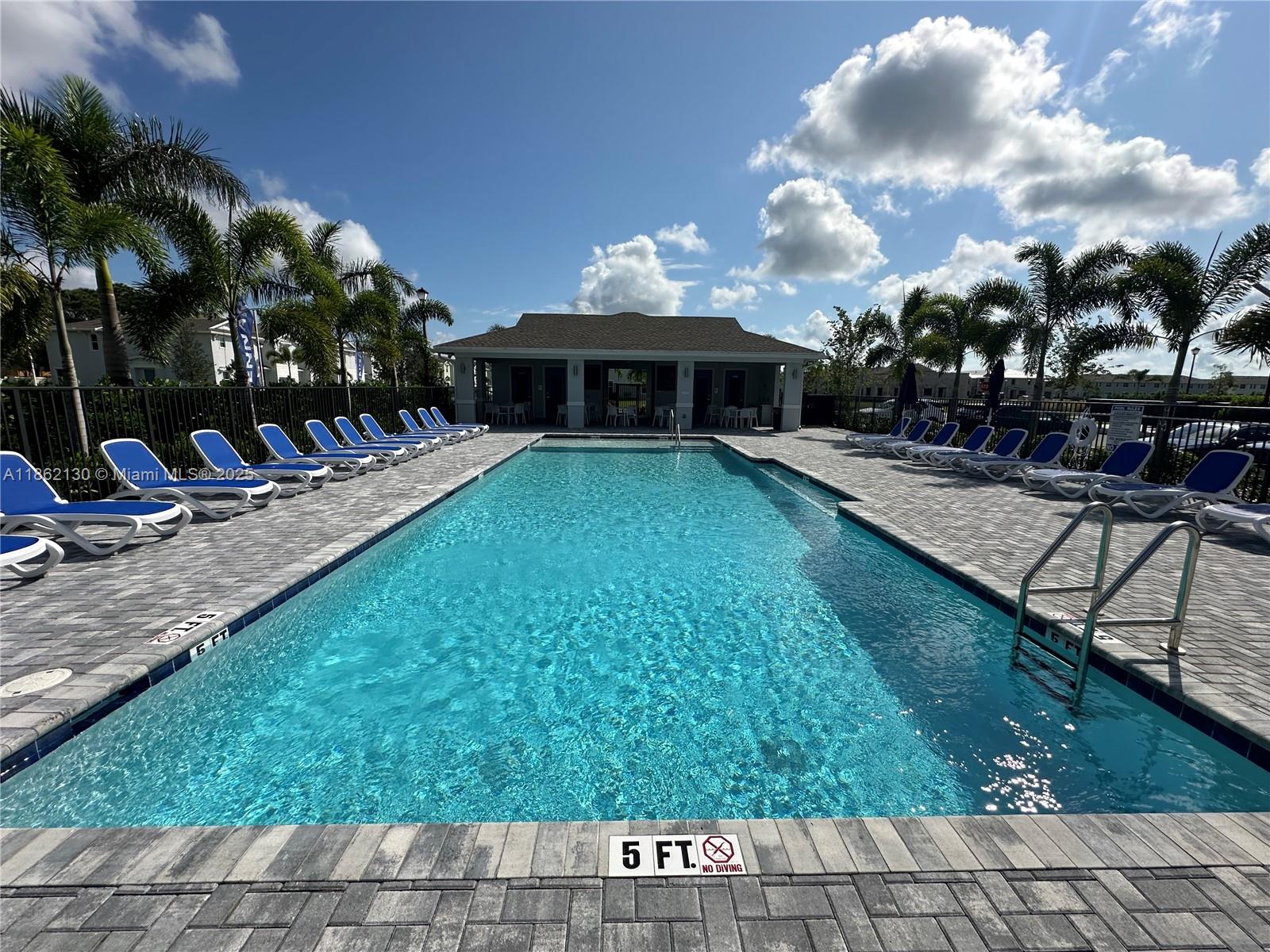 402 Southeast Crossoak Lane, Unit 402 Port St. Lucie, FL 34984 - Photo 16 of 87 a view of a house with backyard and sitting area