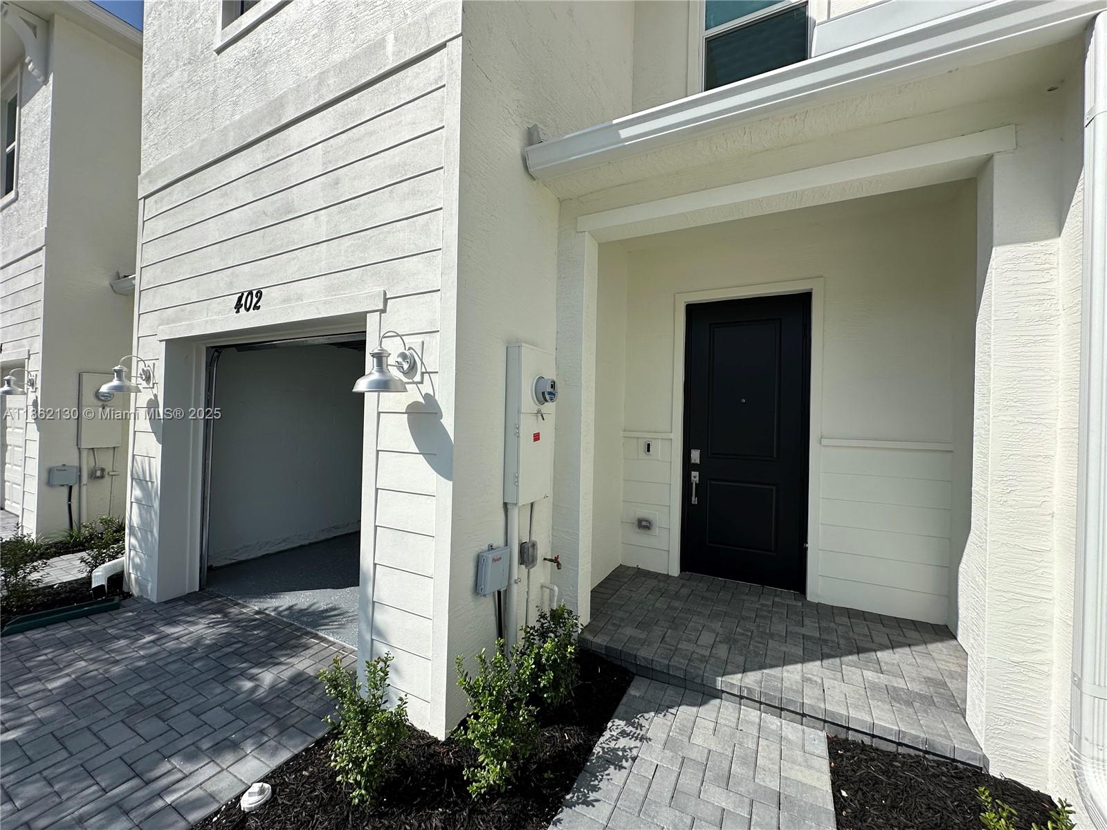 402 Southeast Crossoak Lane, Unit 402 Port St. Lucie, FL 34984 - Photo 18 of 87 a view of a front door of the house