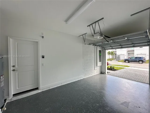 a view of empty room with floor to ceiling window