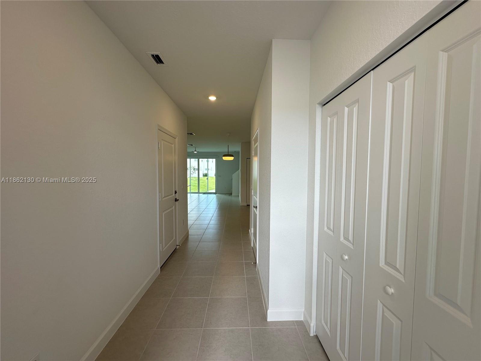 402 Southeast Crossoak Lane, Unit 402 Port St. Lucie, FL 34984 - Photo 20 of 87 a view of a hallway with a wooden space