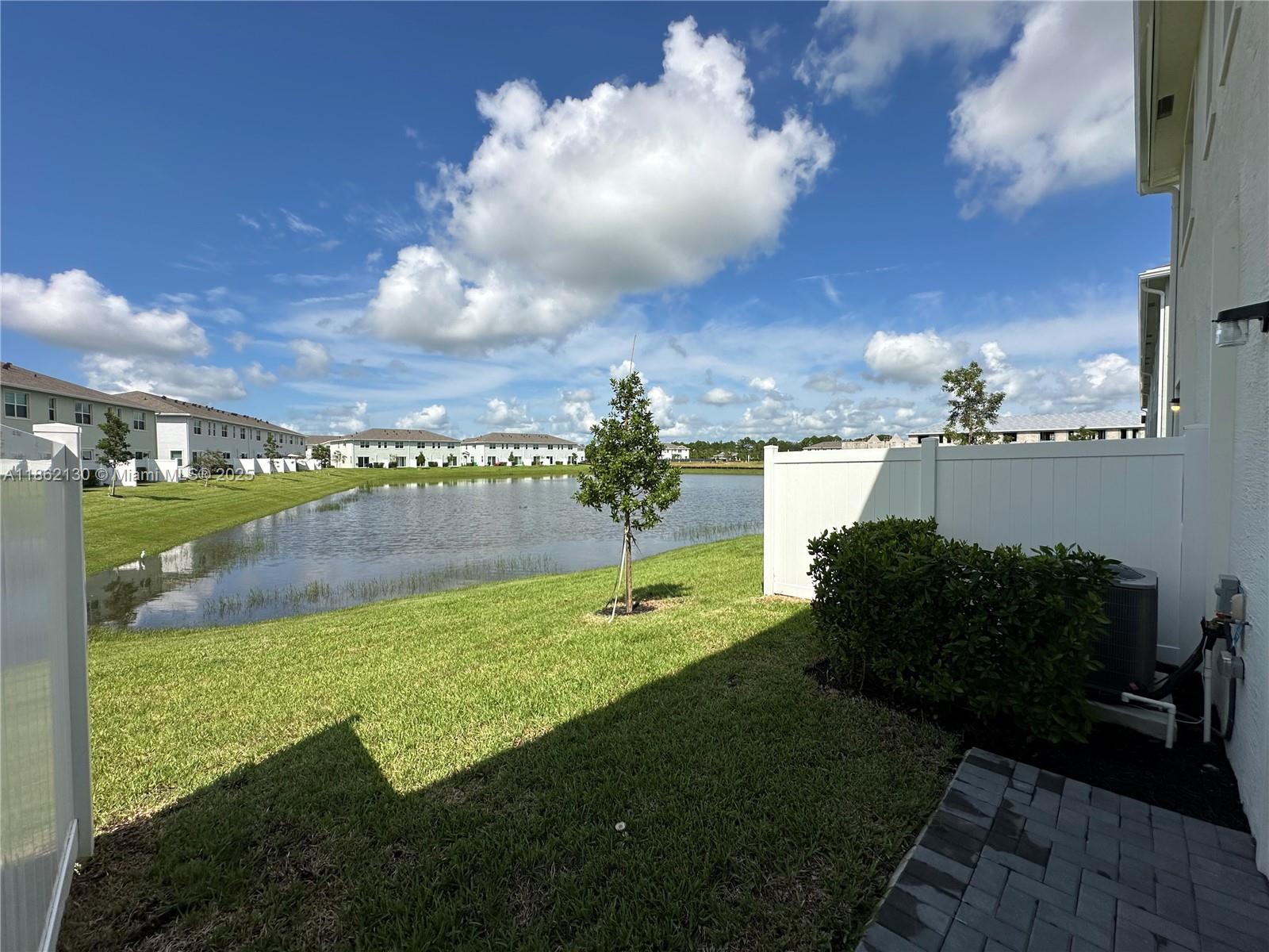 402 Southeast Crossoak Lane, Unit 402 Port St. Lucie, FL 34984 - Photo 2 of 87 a view of a garden