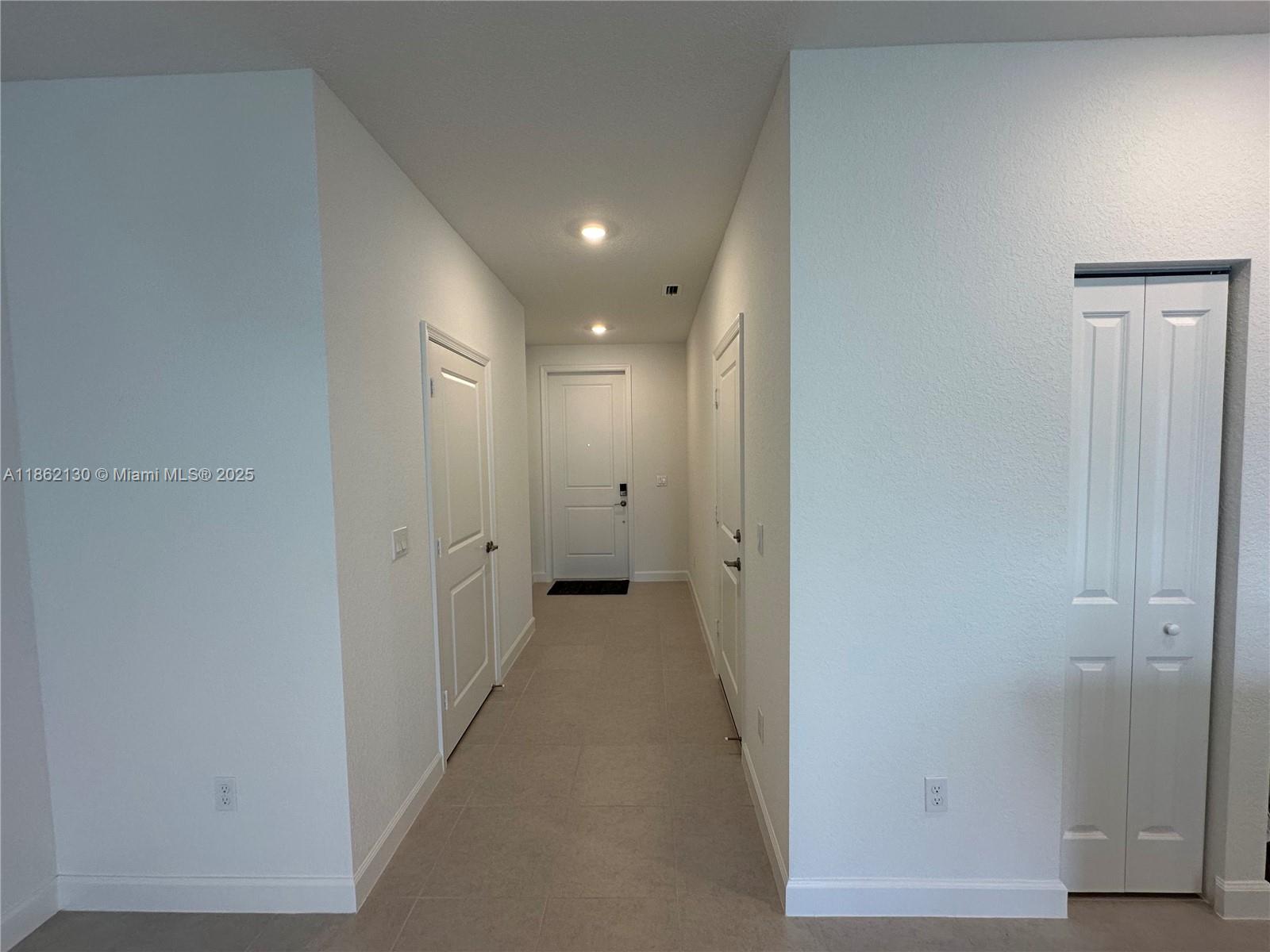 402 Southeast Crossoak Lane, Unit 402 Port St. Lucie, FL 34984 - Photo 21 of 87 a view of a hallway
