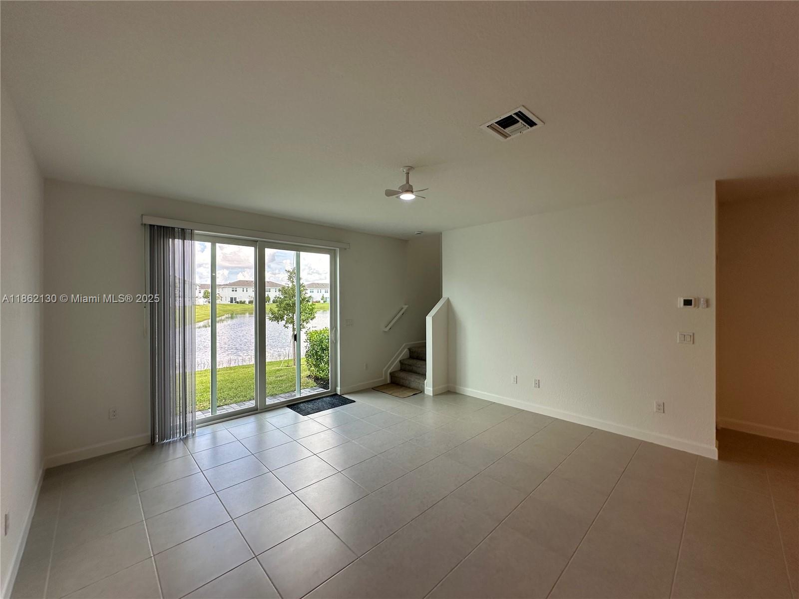402 Southeast Crossoak Lane, Unit 402 Port St. Lucie, FL 34984 - Photo 27 of 87 a view of an empty room with a window
