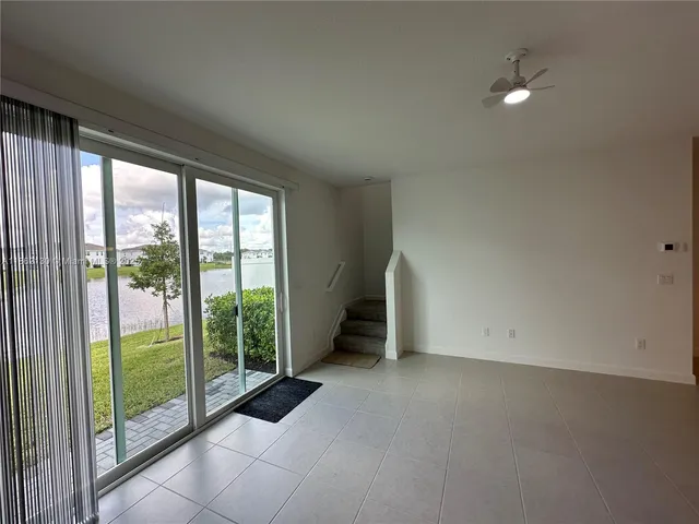 a bathroom with a shower and a glass door