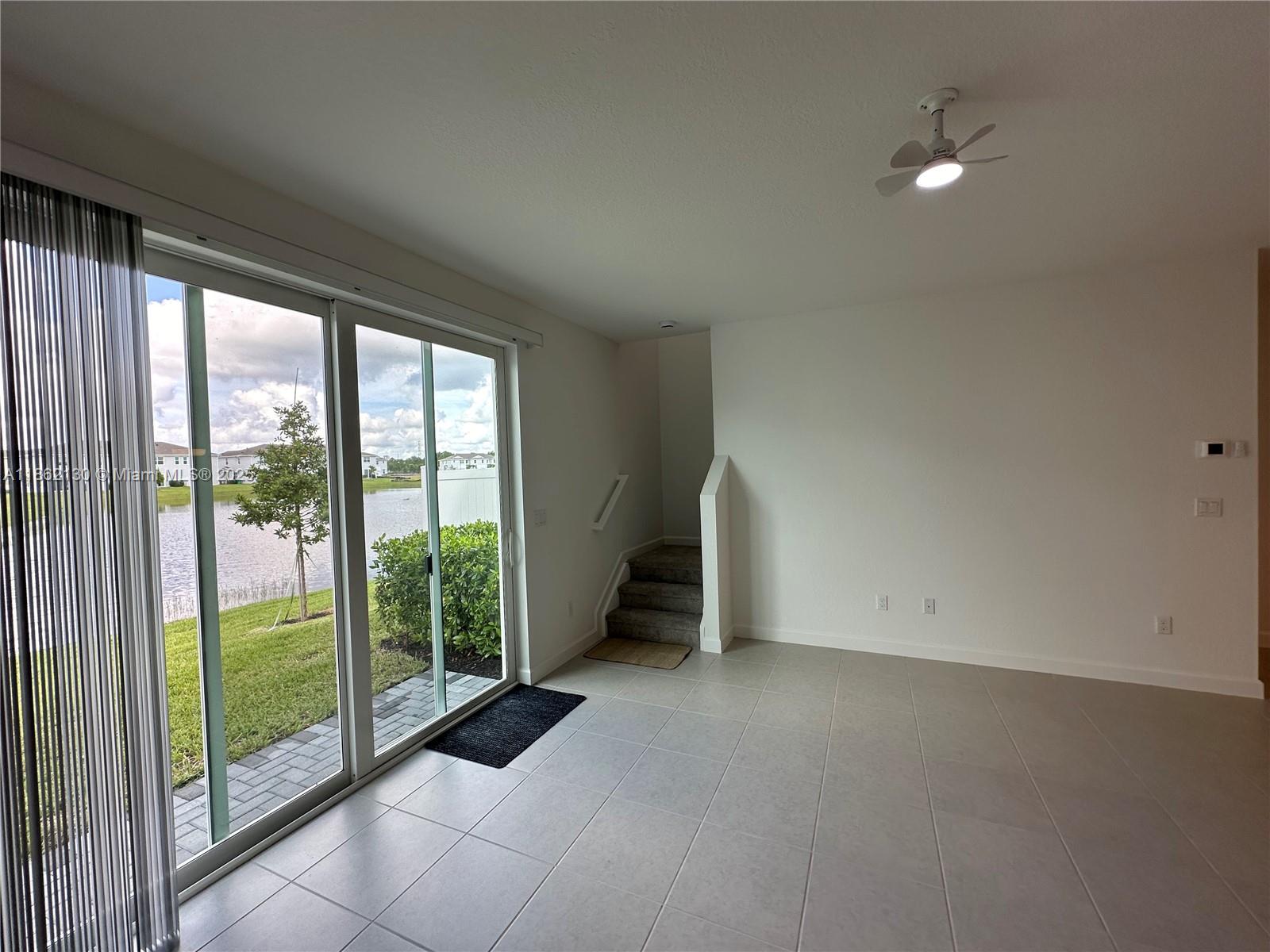 402 Southeast Crossoak Lane, Unit 402 Port St. Lucie, FL 34984 - Photo 28 of 87 a view of empty room with floor to ceiling window