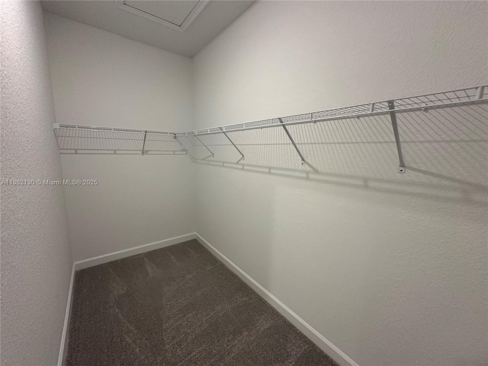 402 Southeast Crossoak Lane, Unit 402 Port St. Lucie, FL 34984 - Photo 41 of 87 a view of a room with racks on the wall