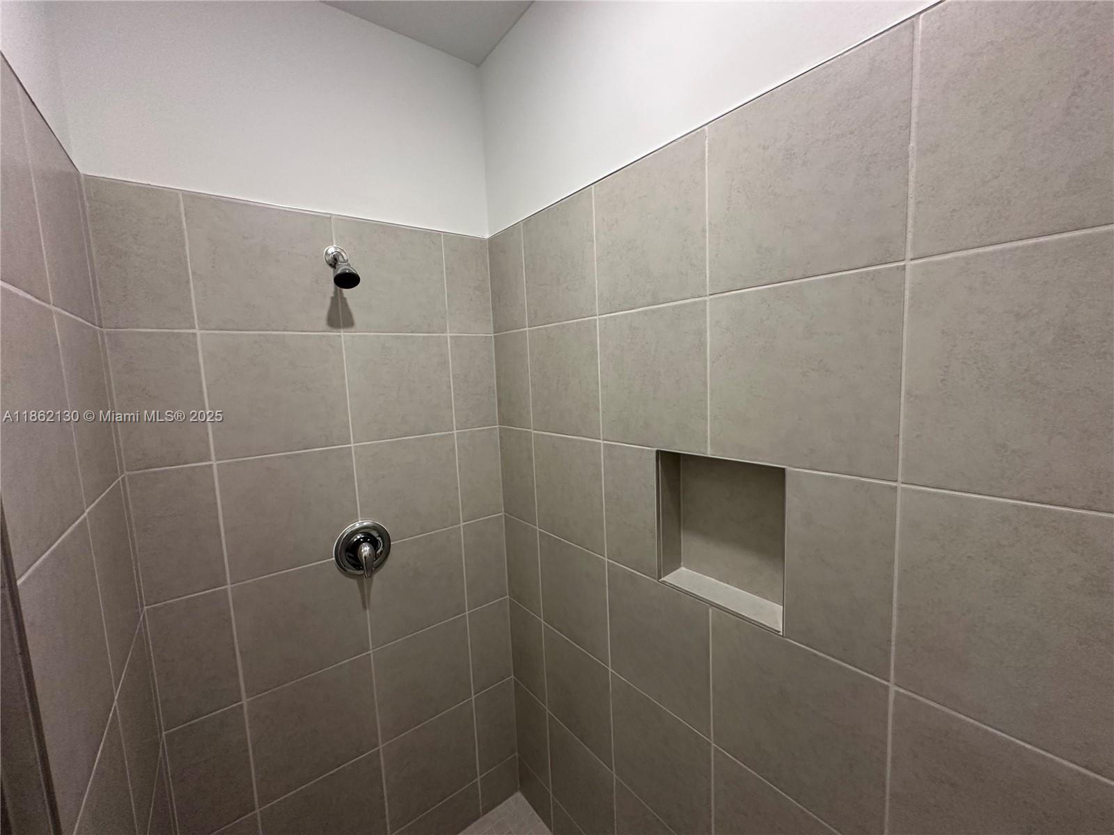 402 Southeast Crossoak Lane, Unit 402 Port St. Lucie, FL 34984 - Photo 44 of 87 a bathroom with a shower