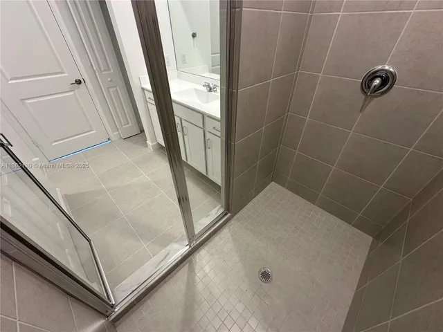 a kitchen with stainless steel appliances a refrigerator and a sink
