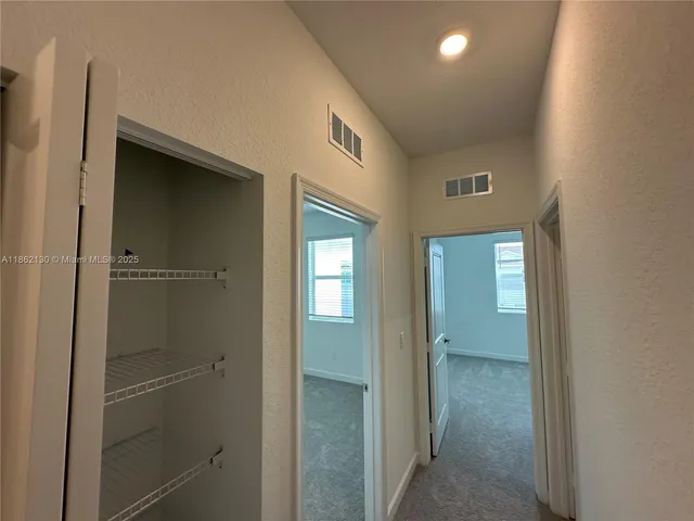 a kitchen with stainless steel appliances a refrigerator and a stove