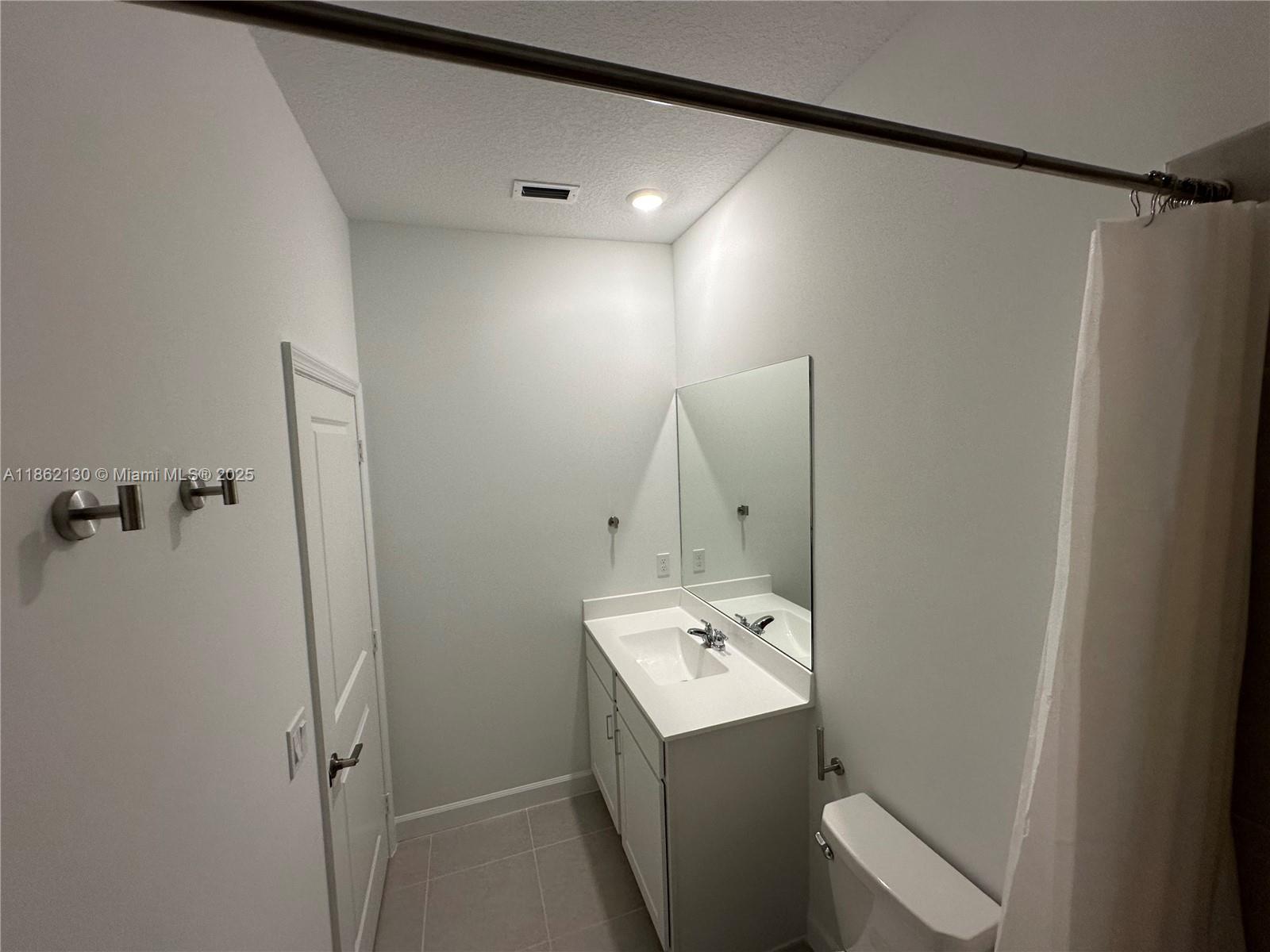 402 Southeast Crossoak Lane, Unit 402 Port St. Lucie, FL 34984 - Photo 57 of 87 a utility room with dryer and washer