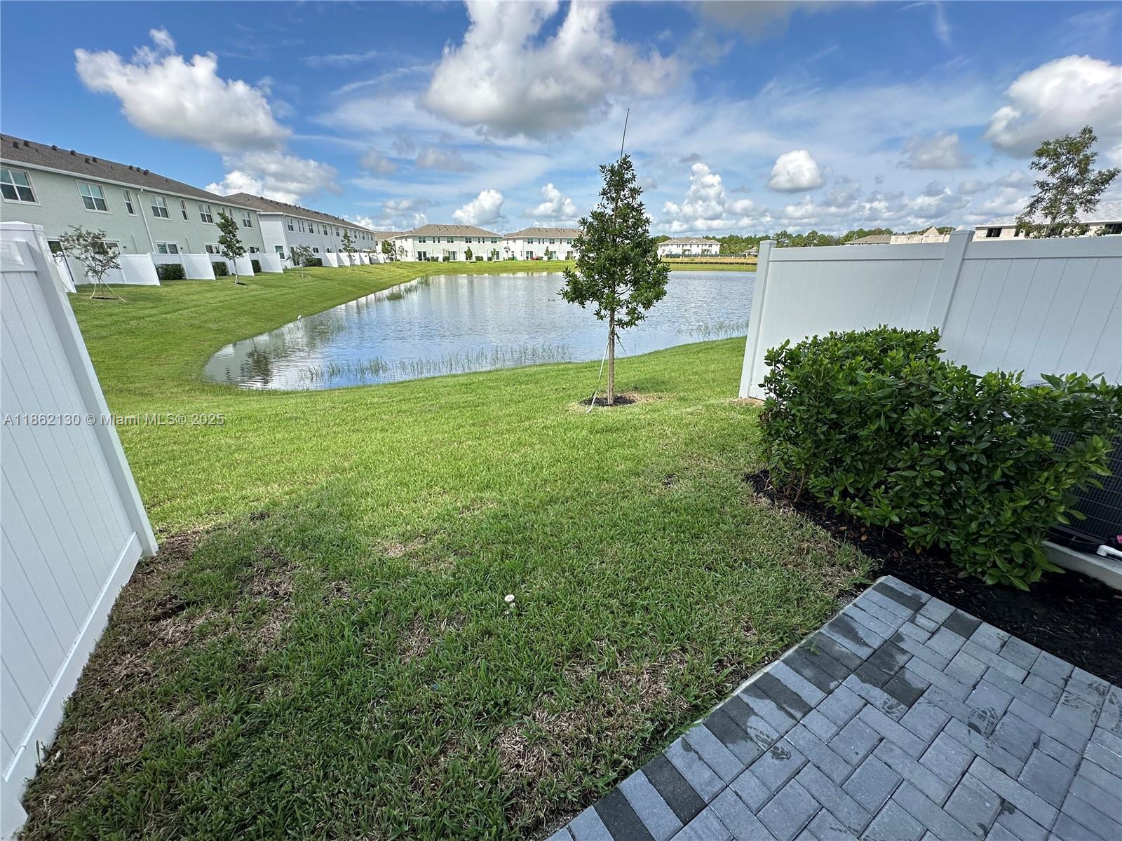 402 Southeast Crossoak Lane, Unit 402 Port St. Lucie, FL 34984 - Photo 66 of 87 a view of a garden