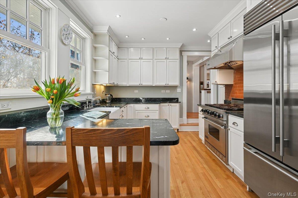 31 Emerson Road Larchmont, NY 10538 - Photo 11 of 43 This view shows peninsula seating overlooking the kitchen.