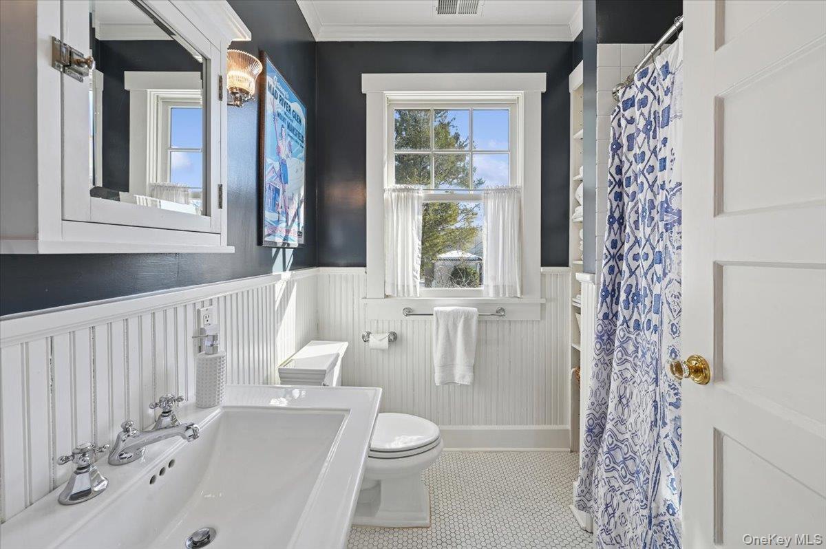 31 Emerson Road Larchmont, NY 10538 - Photo 23 of 43 This second floor hall bath (one of two!) has wainscoting, and a bathtub/shower for little ones.