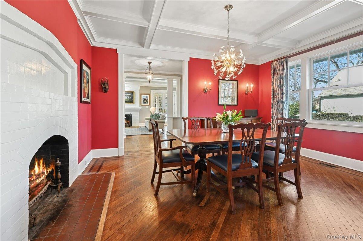 31 Emerson Road Larchmont, NY 10538 - Photo 7 of 43 The dining room is classic and has a working wood burning fireplace. The coffered ceiling adds character for late night dinners. Love this light fixture!